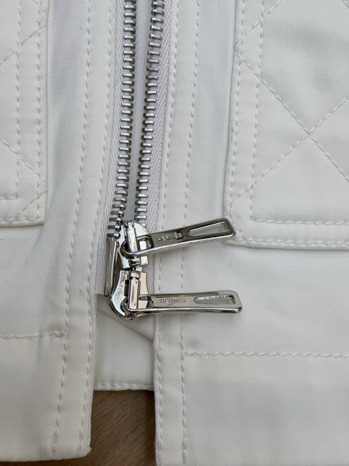 QUILTED ZIP-FRONT SLEEVELESS VEST WITH BELTED DETAIL