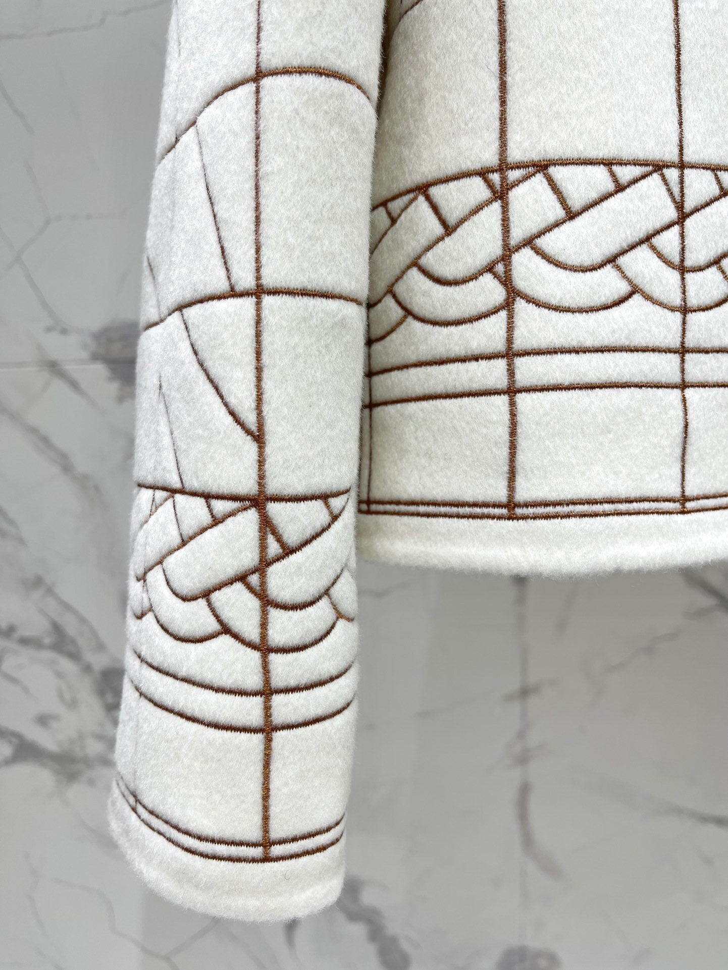 GEOMETRIC PATTERN ZIP JACKET WITH LEATHER TRIM