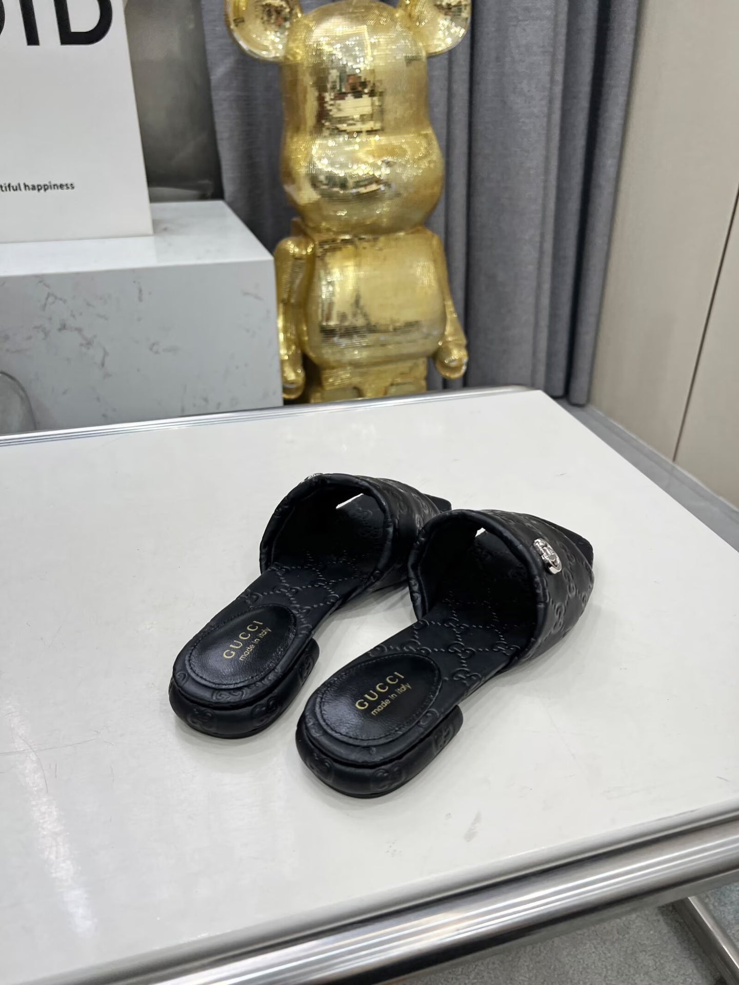 BLACK EMBOSSED LOGO SLIDE SANDALS WITH METAL DETAIL