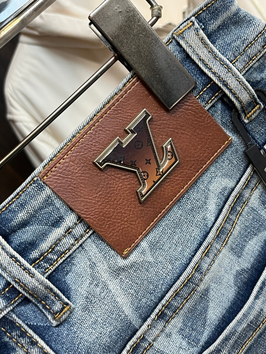 BLUE WASHED DENIM JEANS WITH MONOGRAM PATTERN