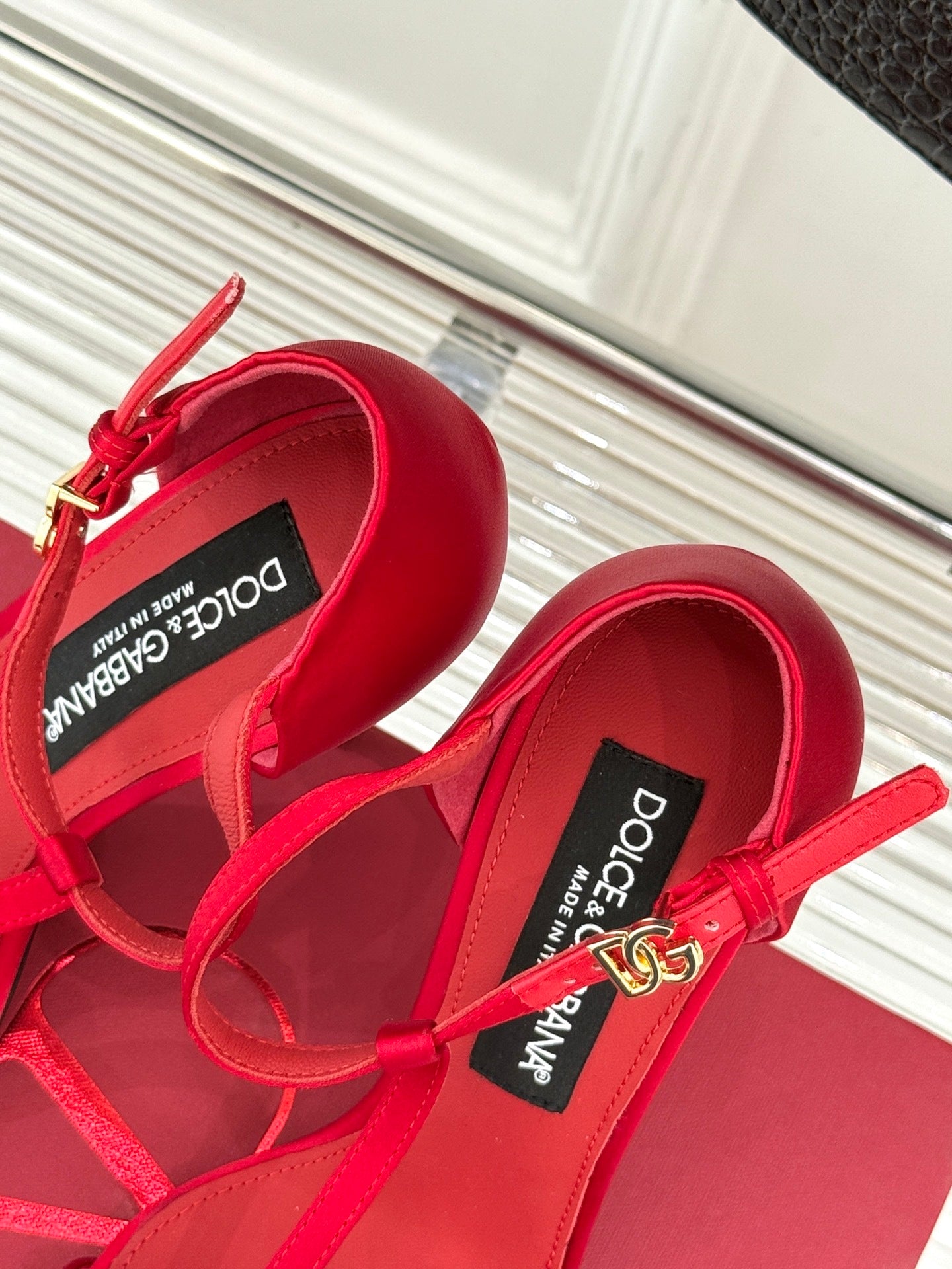 BOLD RED STRAPPY HEEL SANDALS WITH STATEMENT SILHOUETTE