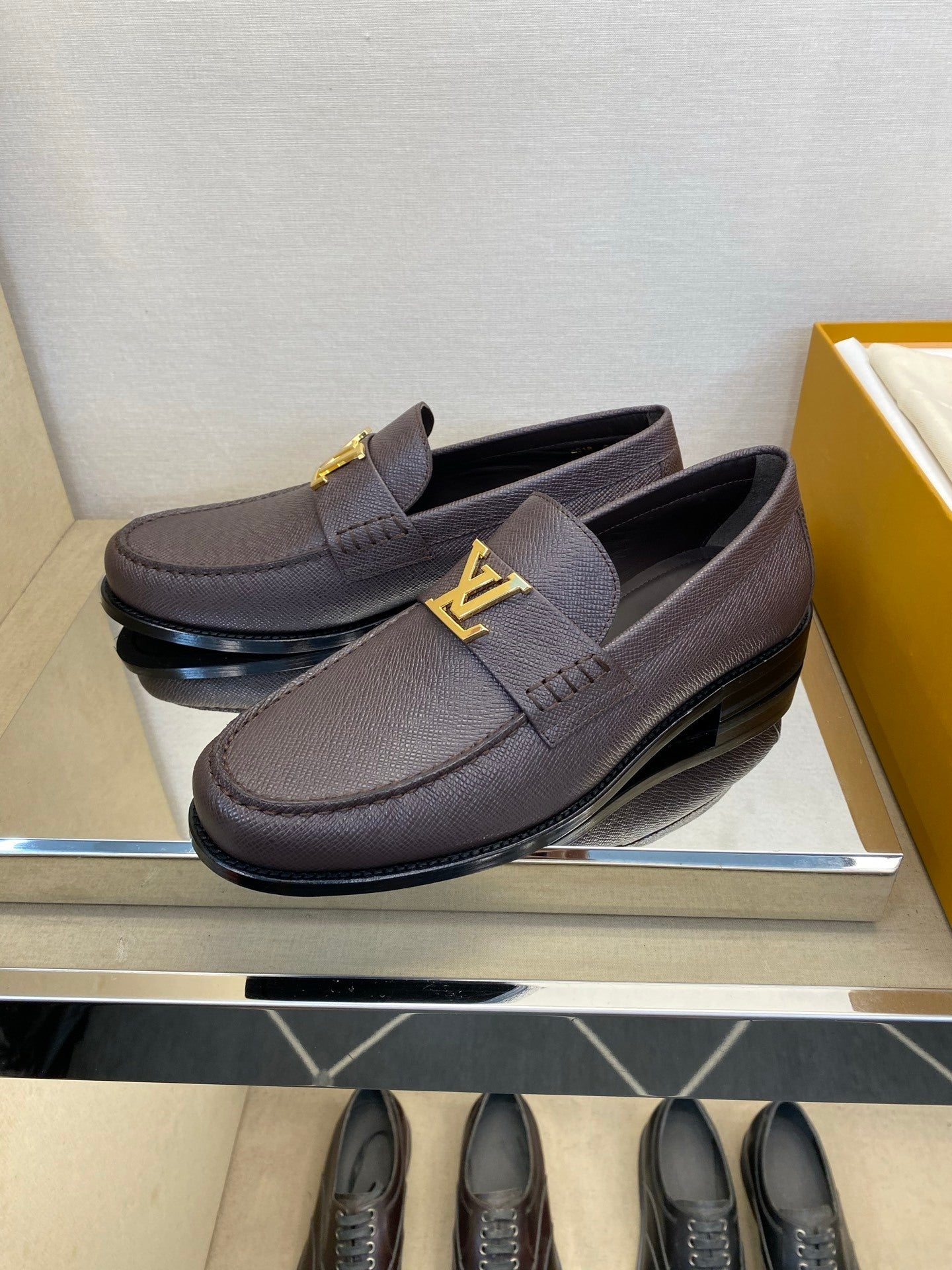 BROWN LEATHER SLIP-ON LOAFERS WITH GOLD-TONE ACCENT