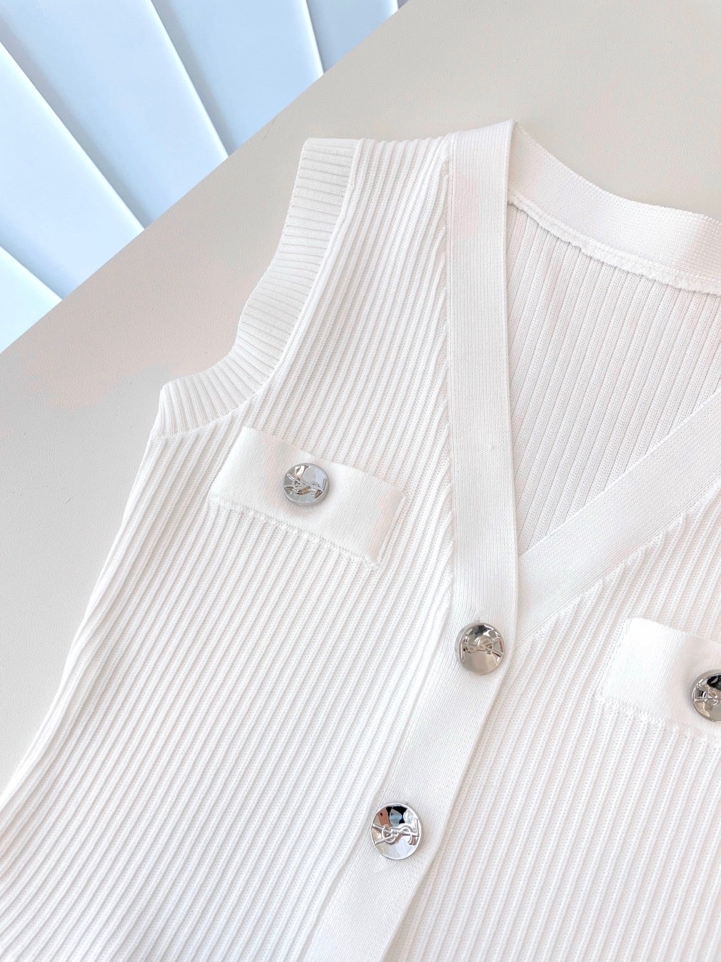 RIBBED PEPLUM KNIT TOP – BUTTON DETAIL