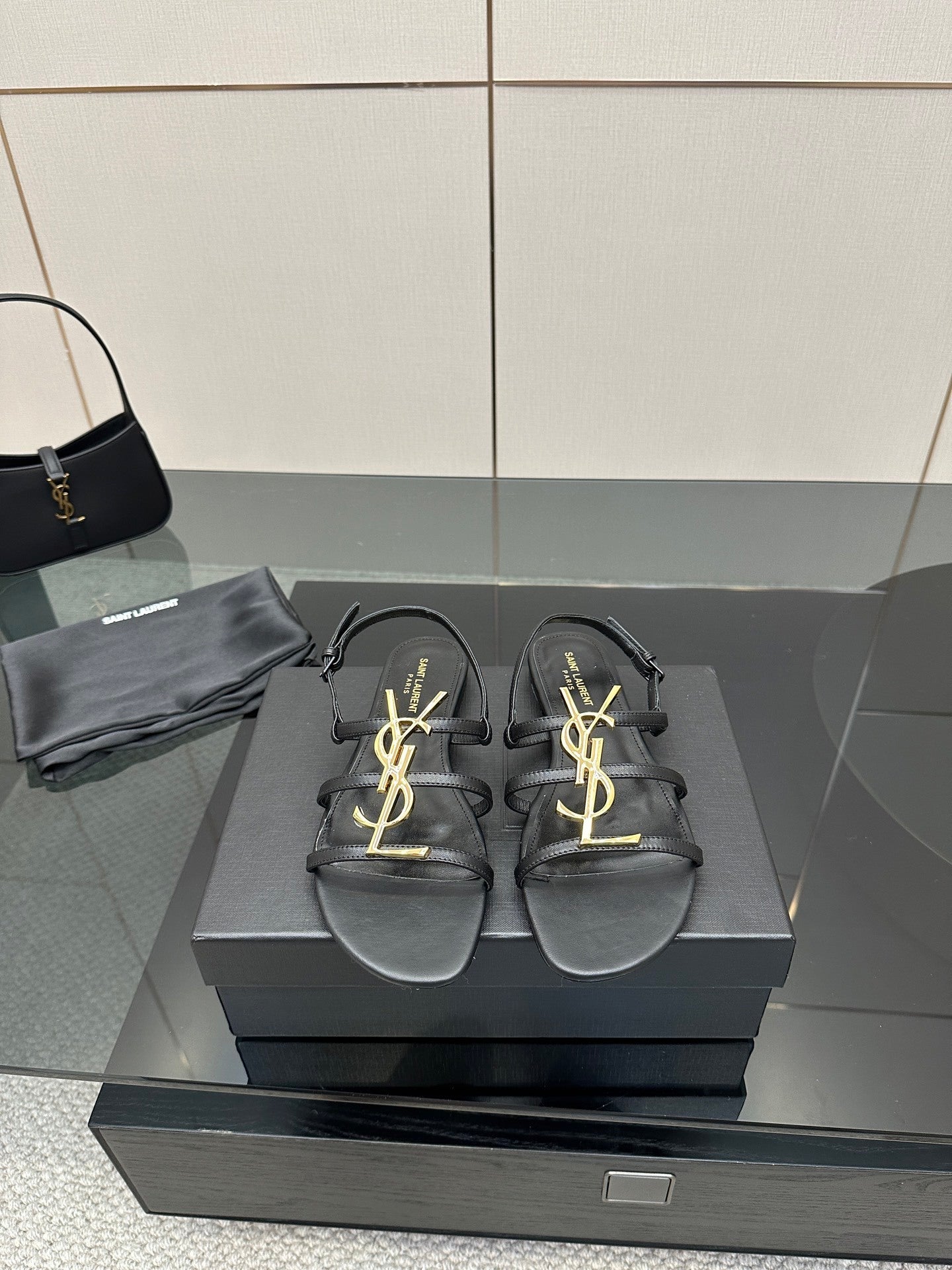 BLACK STRAPPY FLAT SANDALS WITH GOLD LOGO DETAIL
