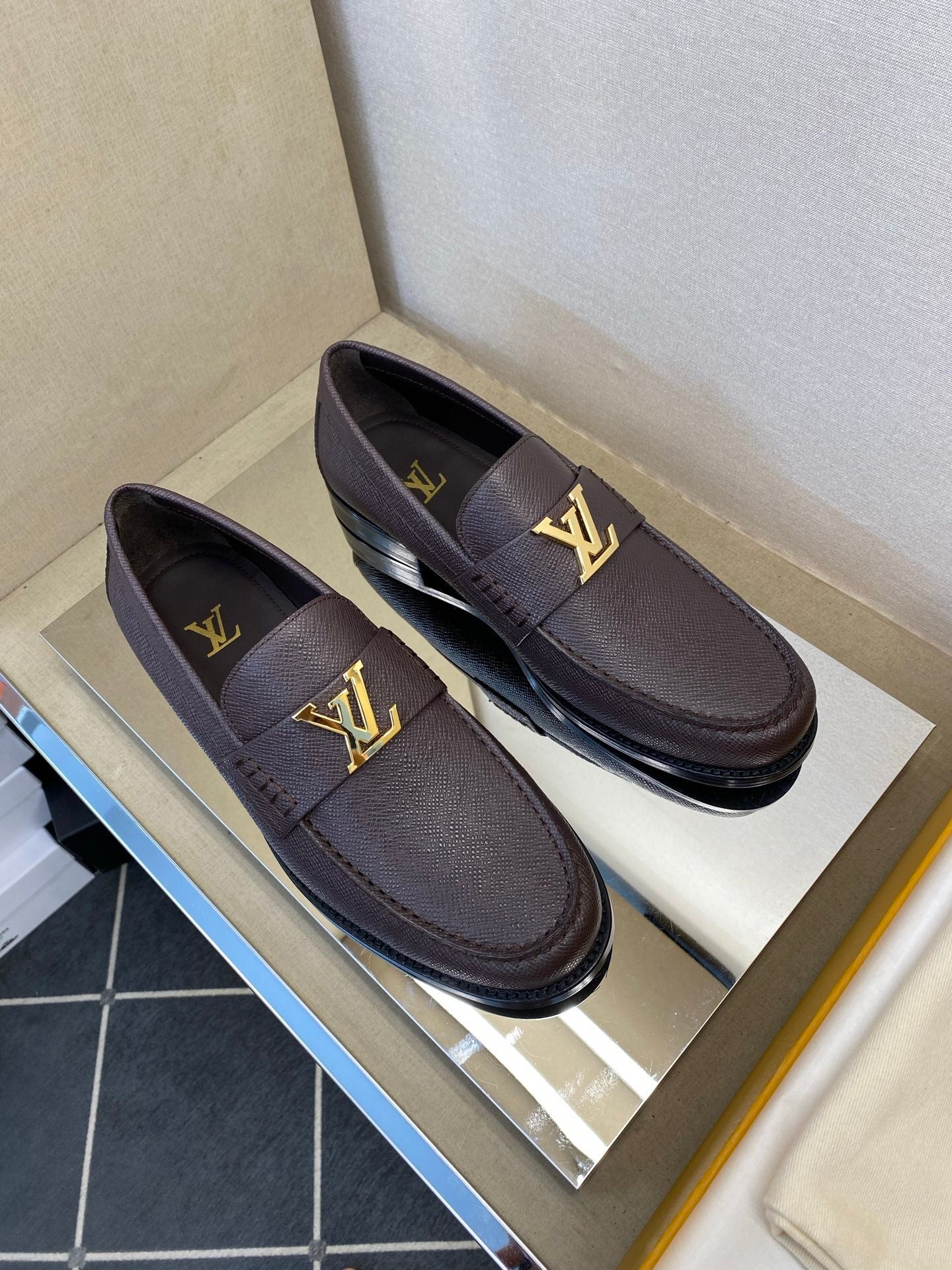 BROWN LEATHER SLIP-ON LOAFERS WITH GOLD-TONE ACCENT