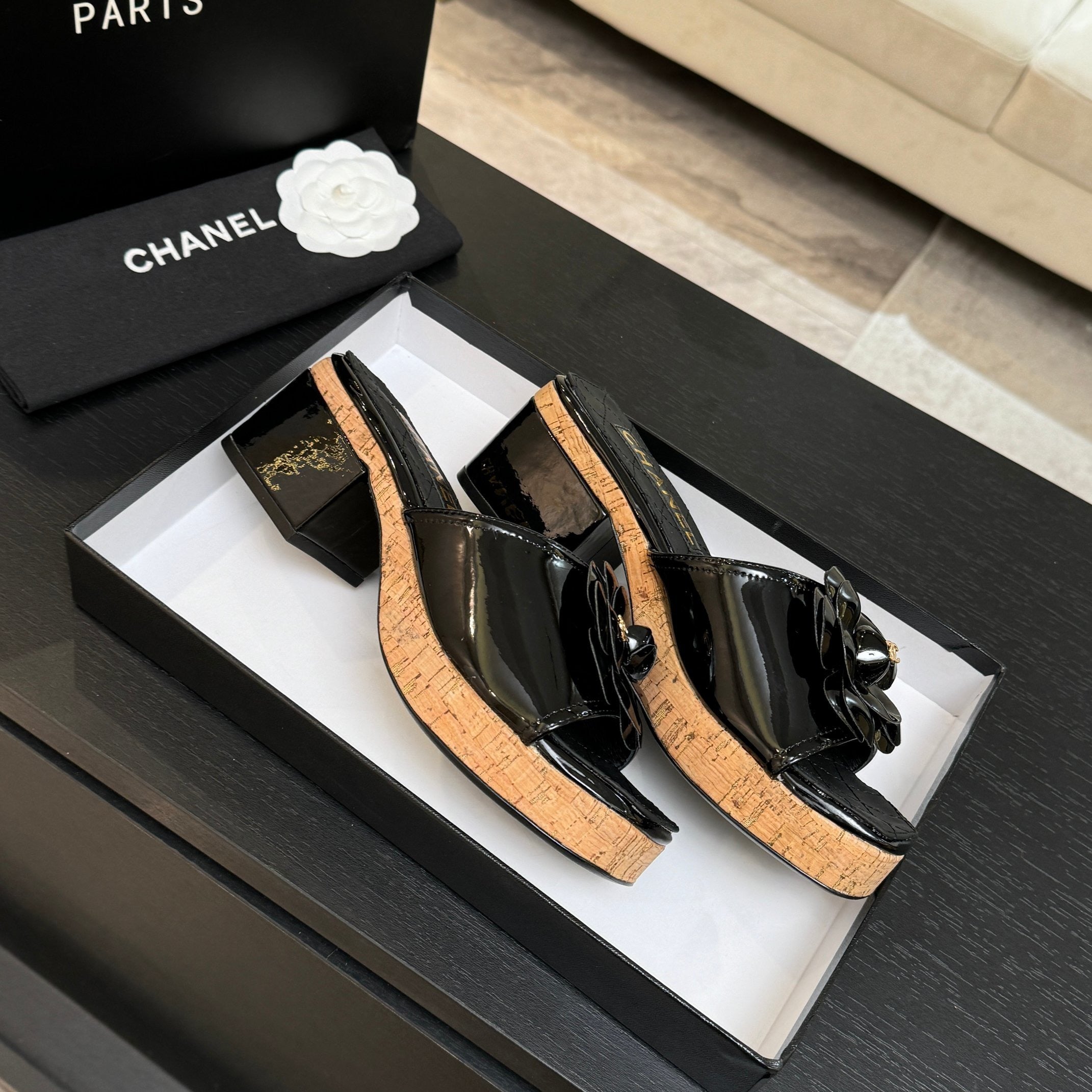 BLACK QUILTED PLATFORM SLIDE SANDALS WITH FLORAL DETAIL