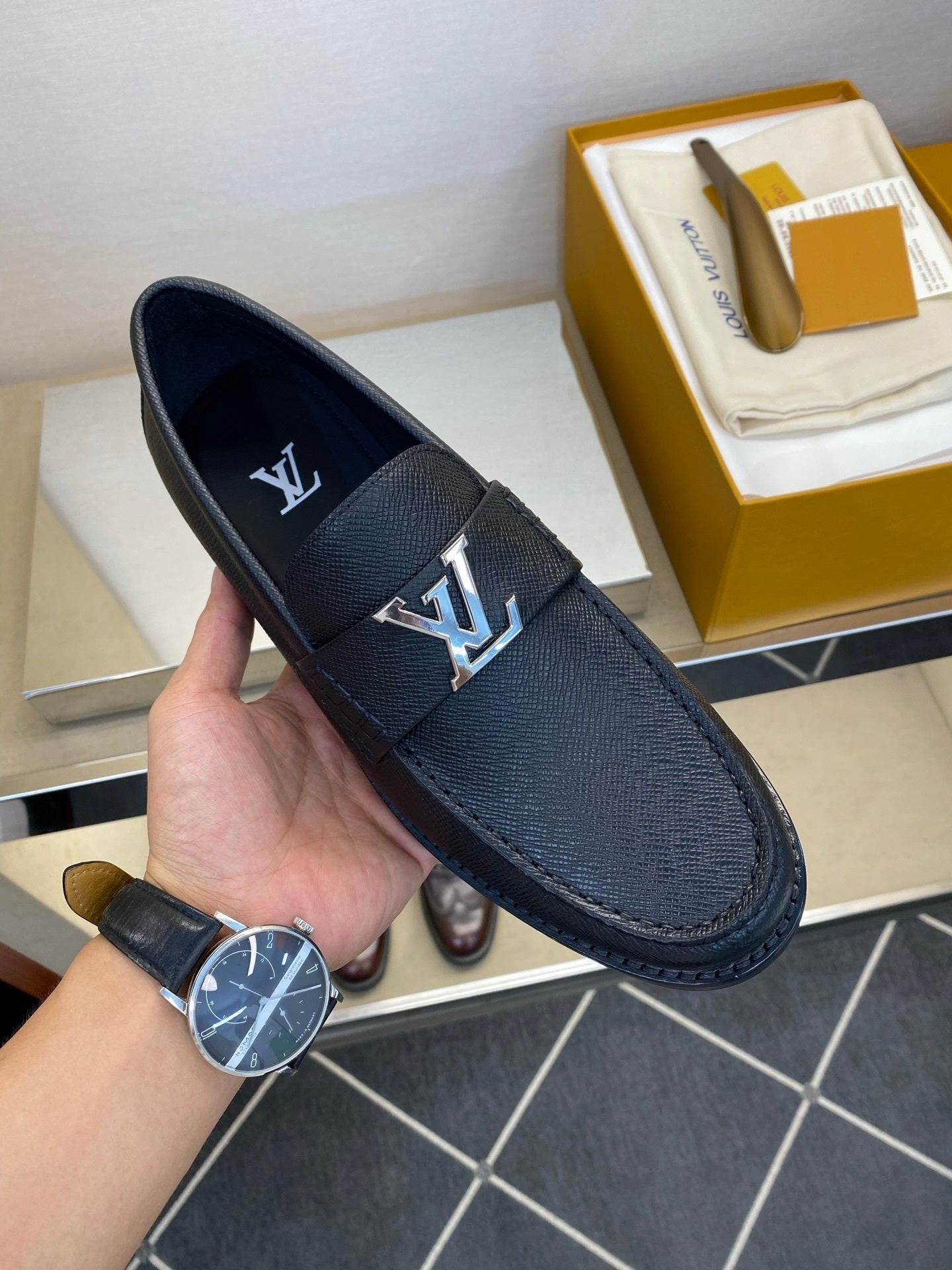 BLACK LEATHER SLIP-ON LOAFERS WITH METAL DETAIL