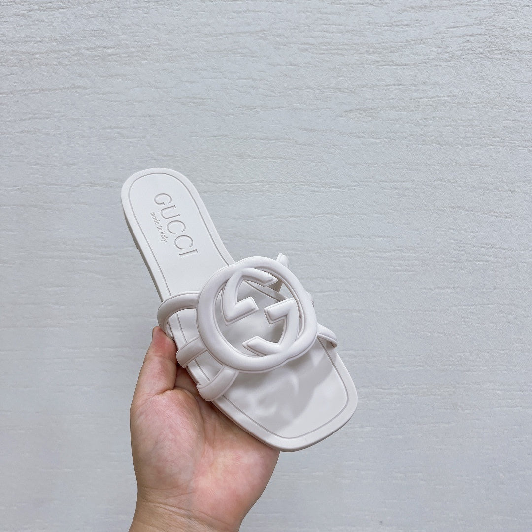 MINIMALIST WHITE SLIDES WITH STATEMENT EMBLEM