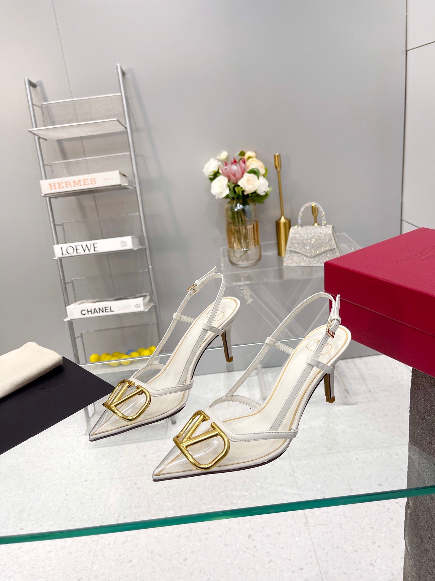 CLEAR SLINGBACK HEELS – ELEGANT WHITE WITH GOLD LOGO DETAIL