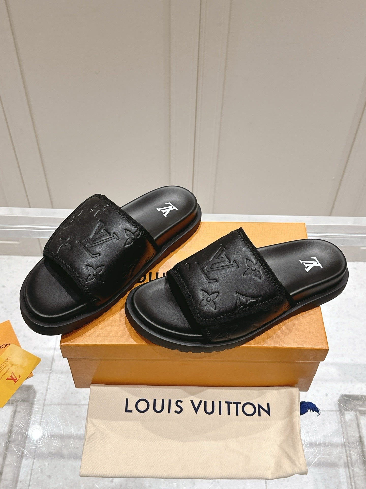 BLACK EMBOSSED SLIDE SANDALS