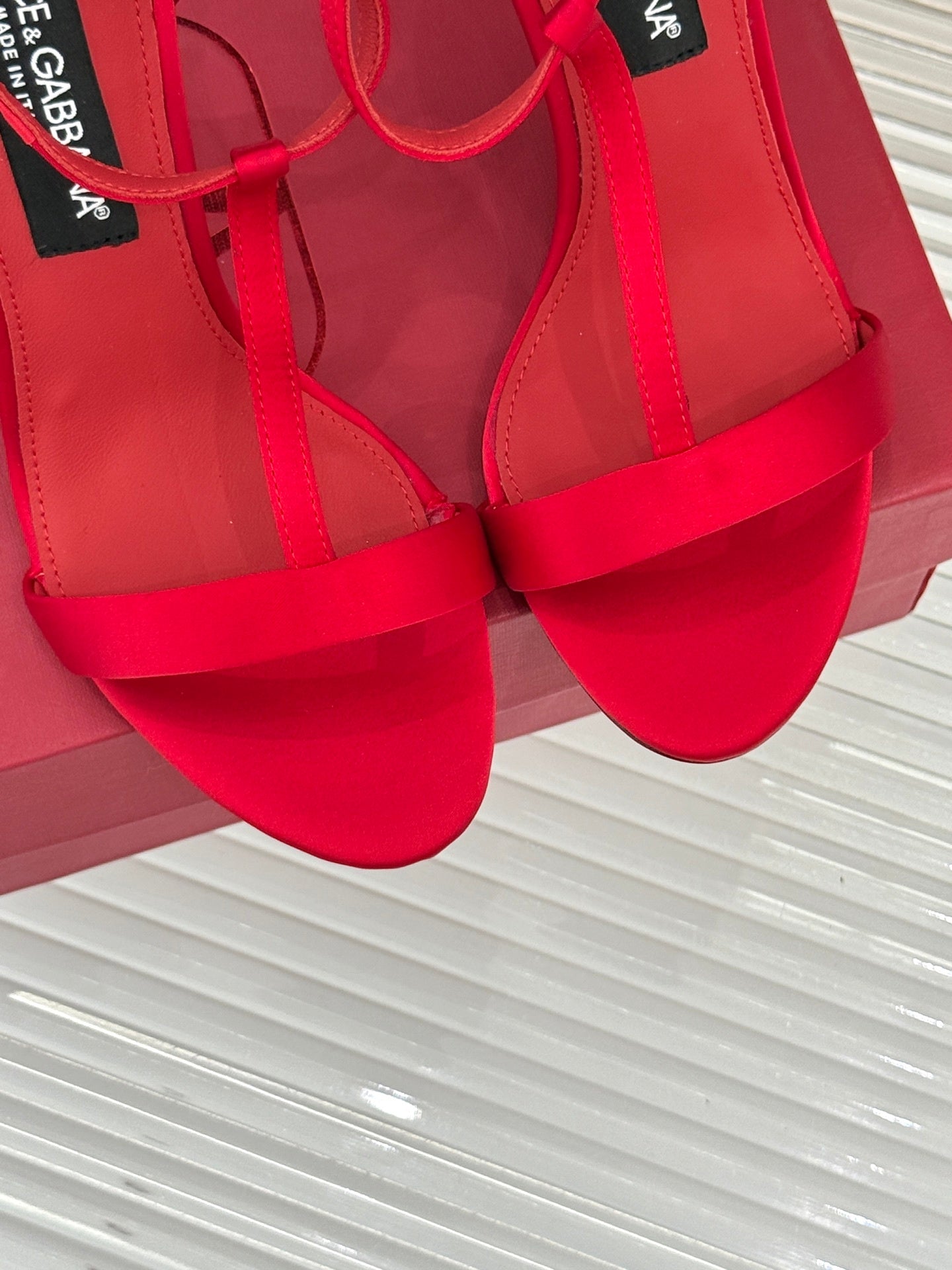 BOLD RED STRAPPY HEEL SANDALS WITH STATEMENT SILHOUETTE