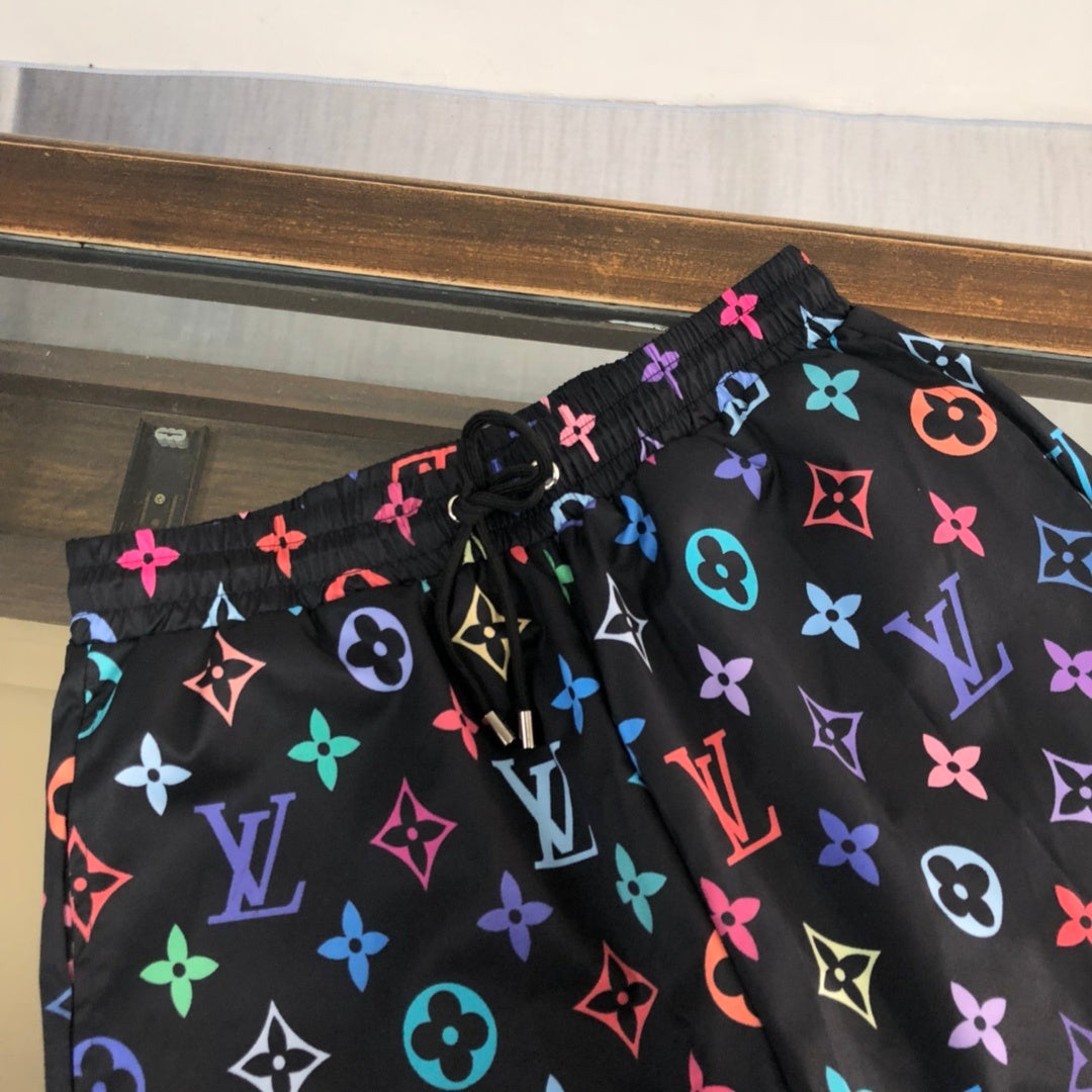 BLACK MULTICOLOR PRINT SWIM SHORTS