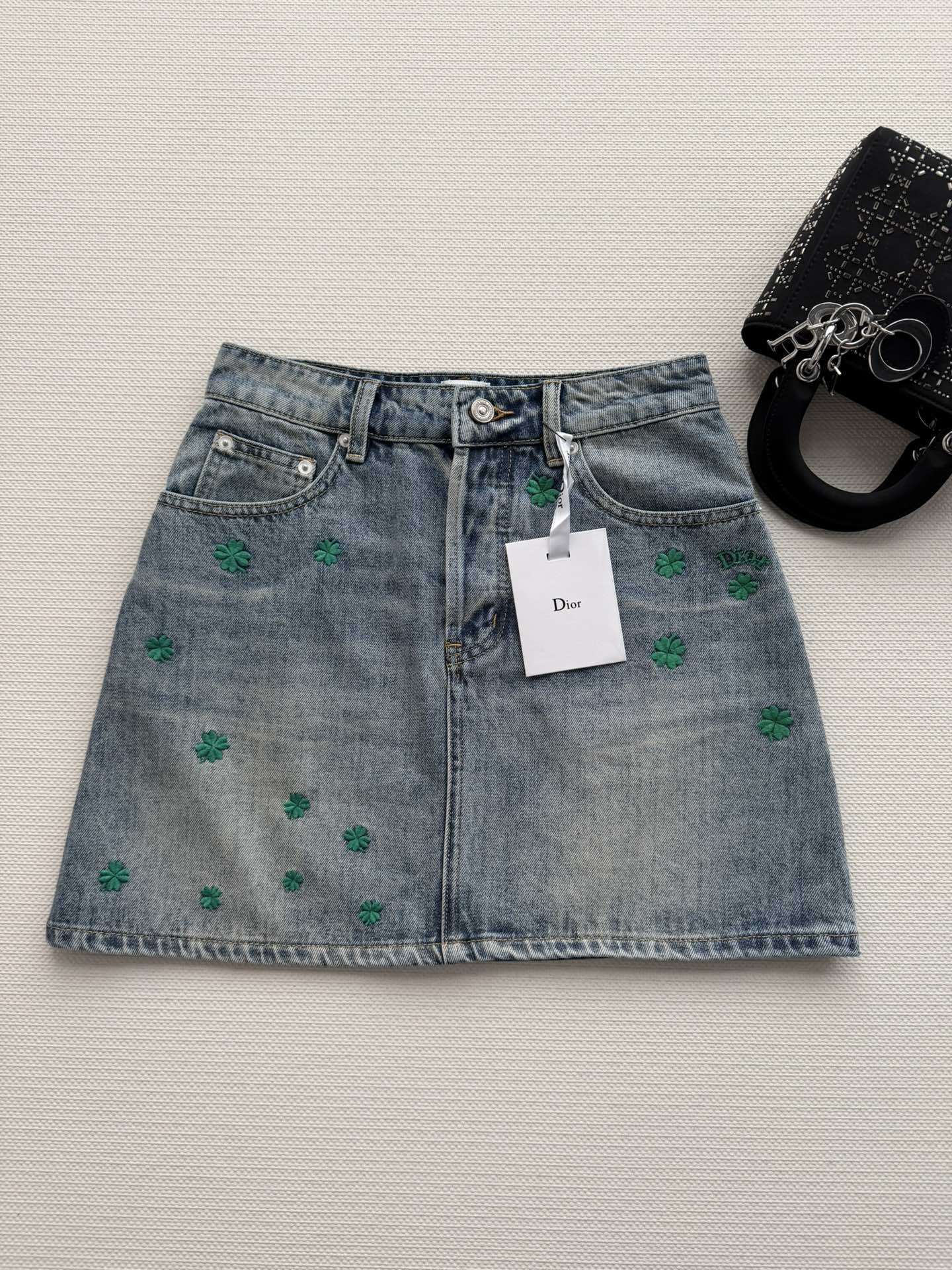 BLUE DENIM MINI SKIRT WITH FLORAL EMBROIDERY
