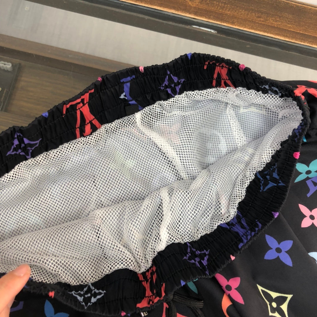 BLACK MULTICOLOR PRINT SWIM SHORTS