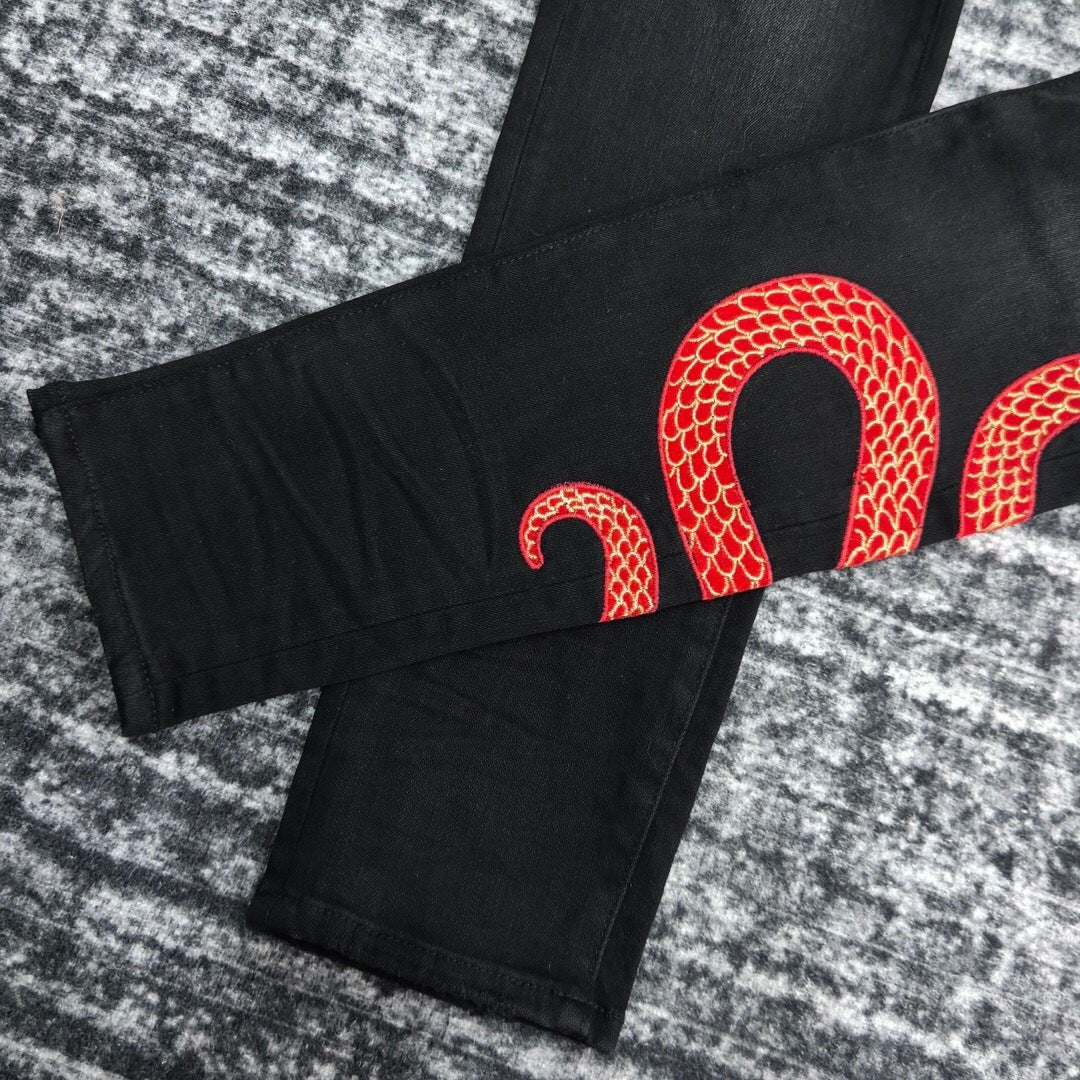 SNAKE GRAPHIC DISTRESSED SKINNY JEANS