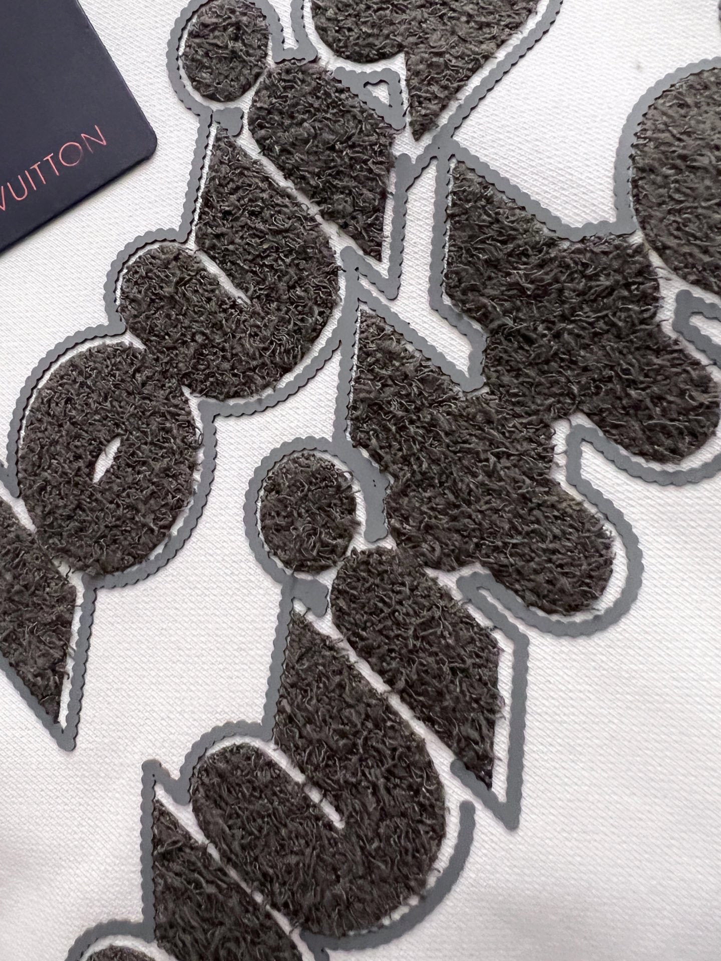 WHITE COTTON SWEATSHIRT WITH EMBOSSED FRONT GRAPHIC