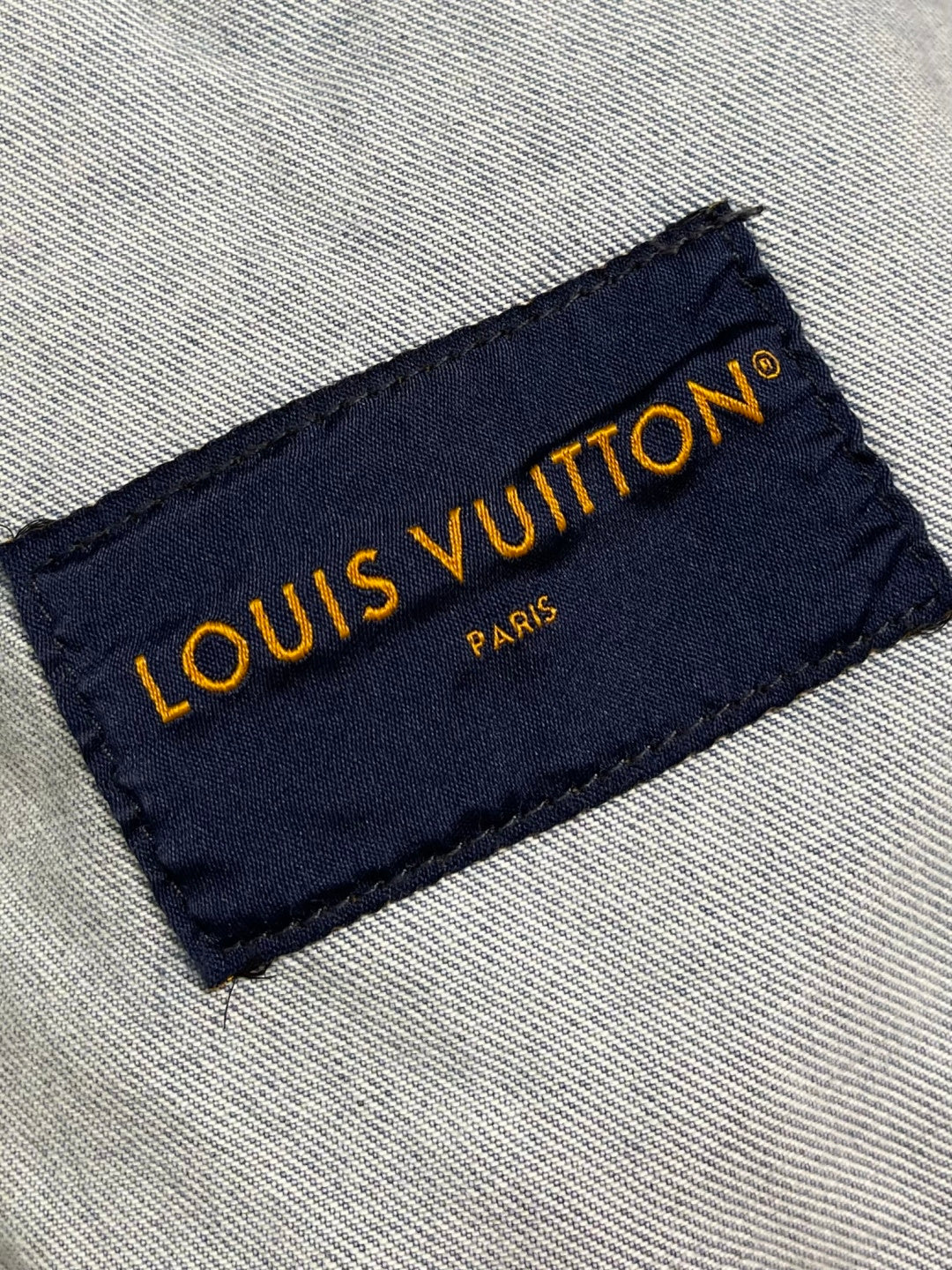 DISTRESSED DENIM TRUCKER JACKET WITH EMBROIDERED DETAILS