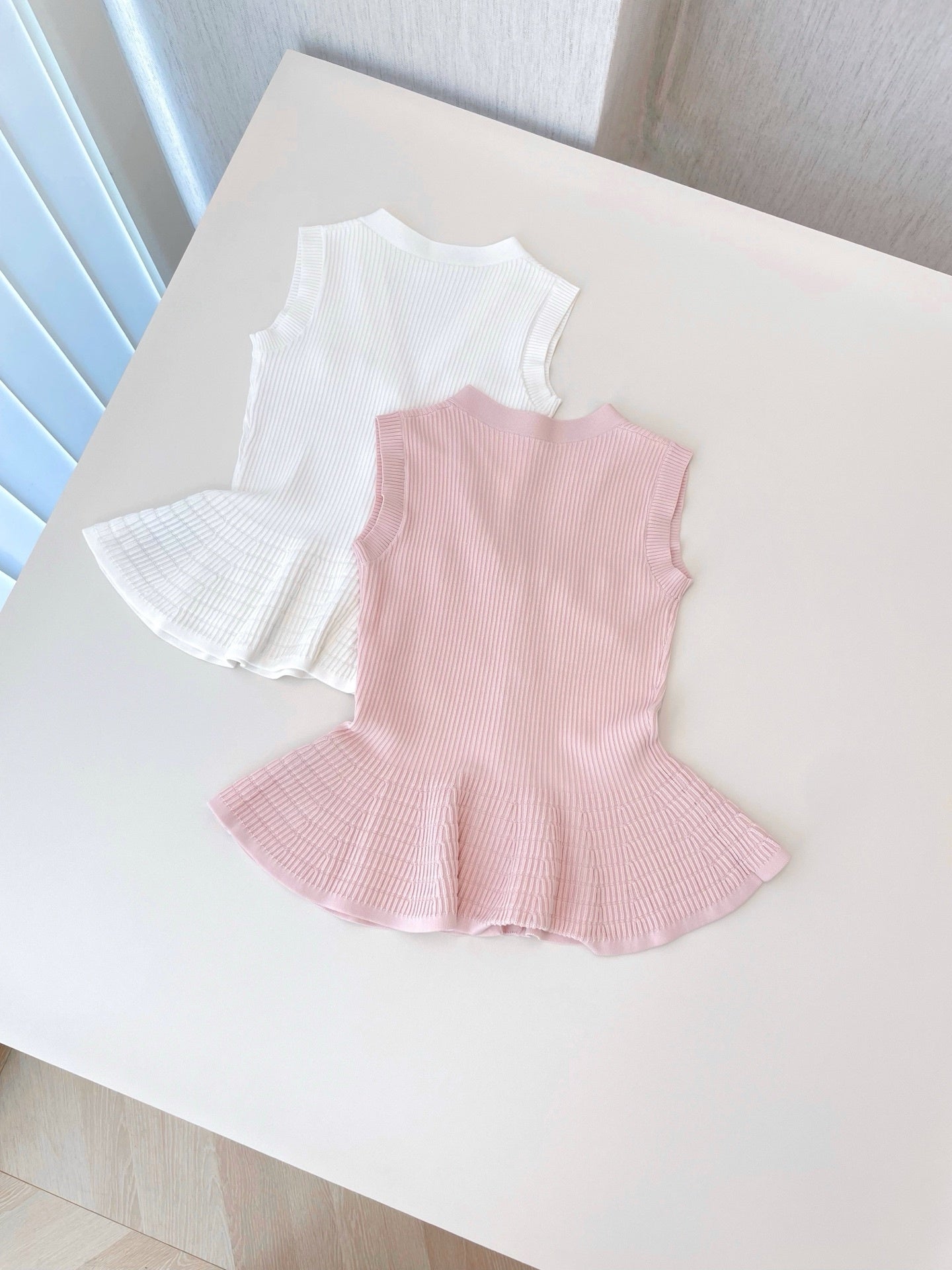 RIBBED PEPLUM KNIT TOP – BUTTON DETAIL