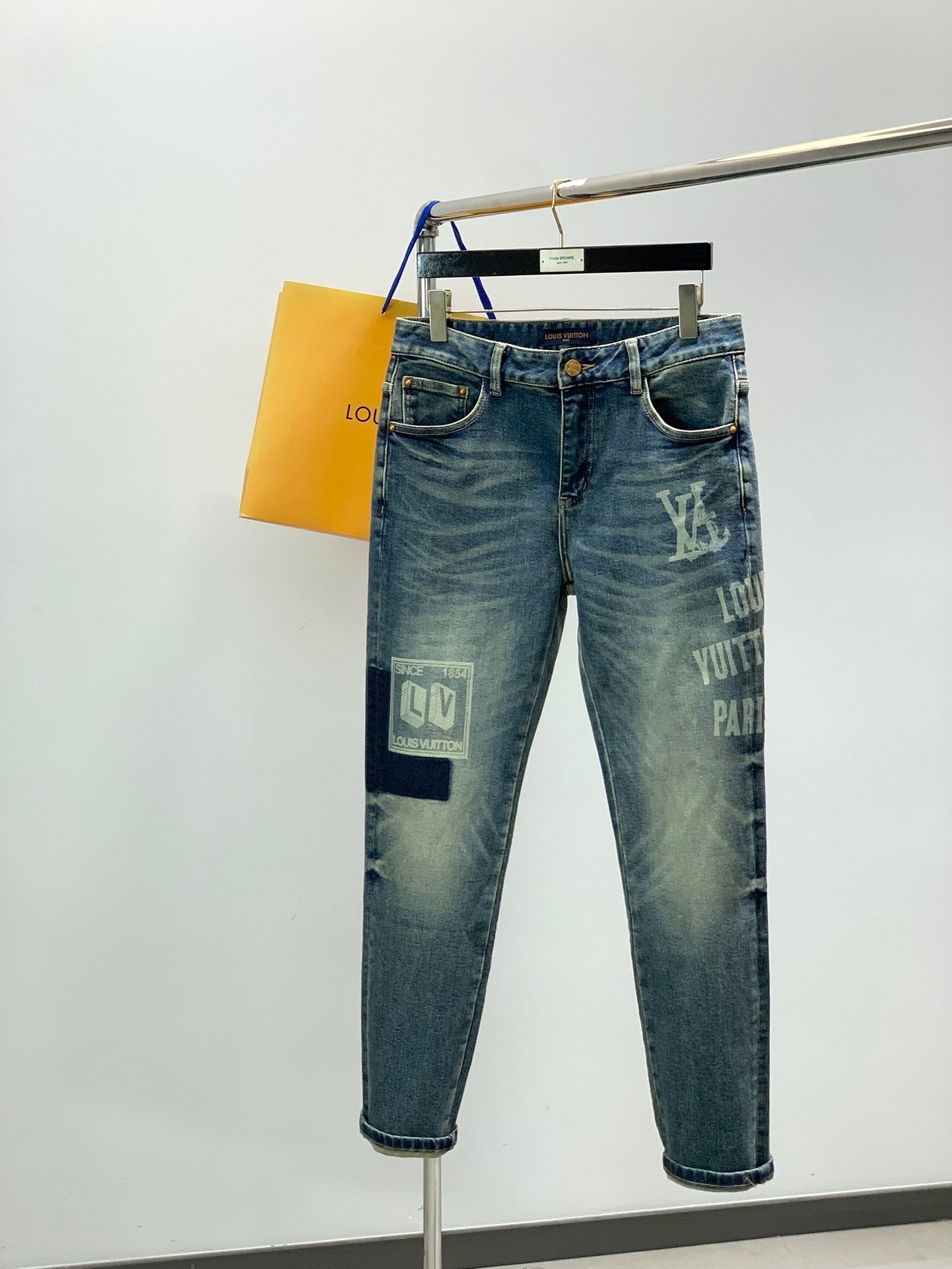 DISTRESSED SLIM-FIT GRAPHIC DENIM JEANS