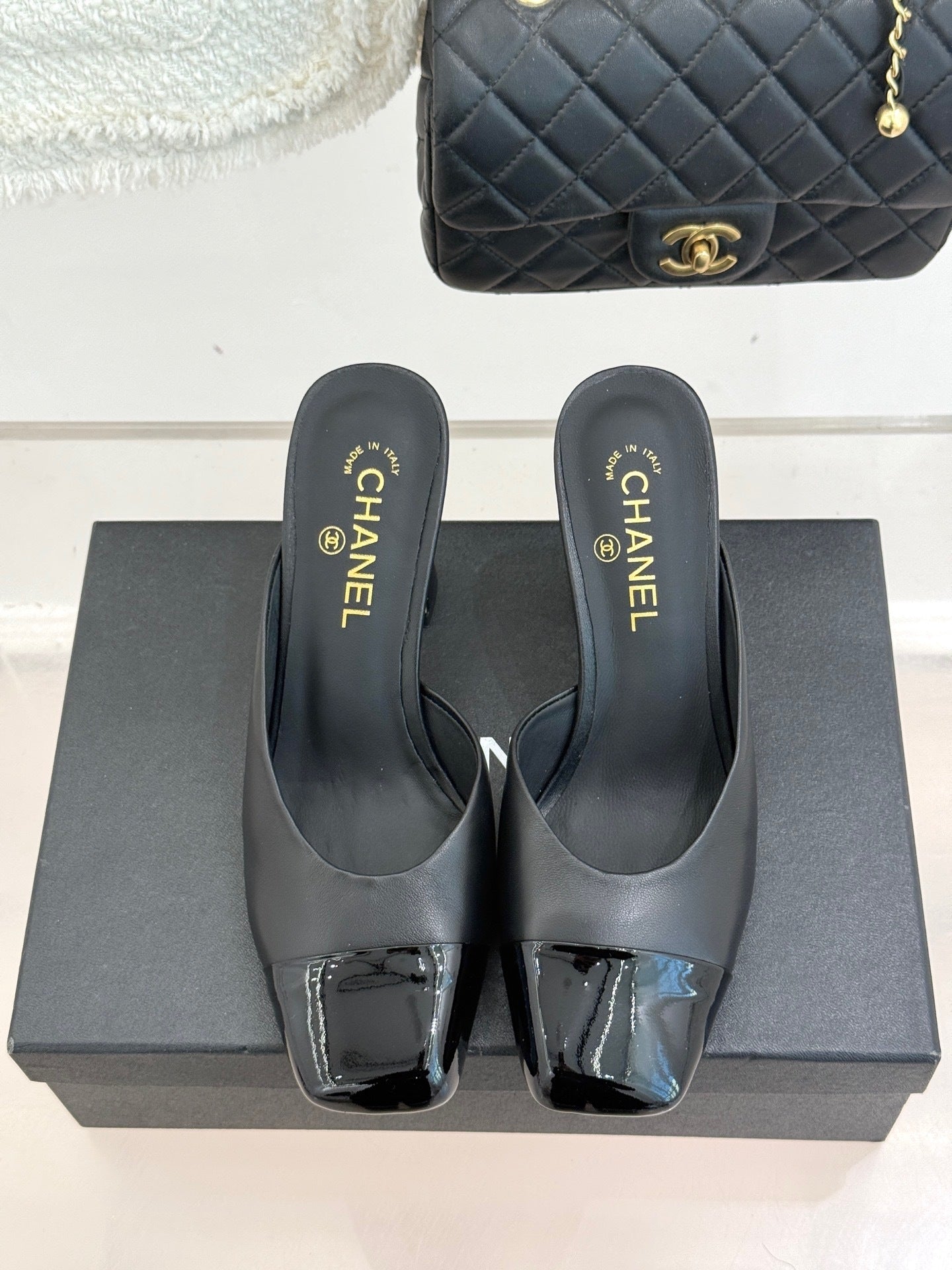 BLACK LEATHER CAP-TOE MULE HEELS WITH GOLD DETAIL