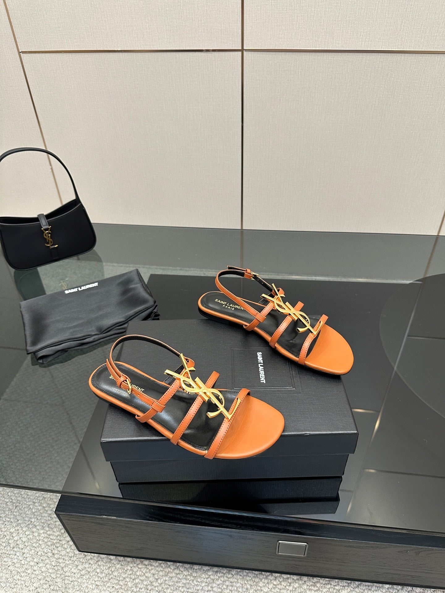 TAN STRAPPY FLAT SANDALS WITH GOLD LOGO DETAIL