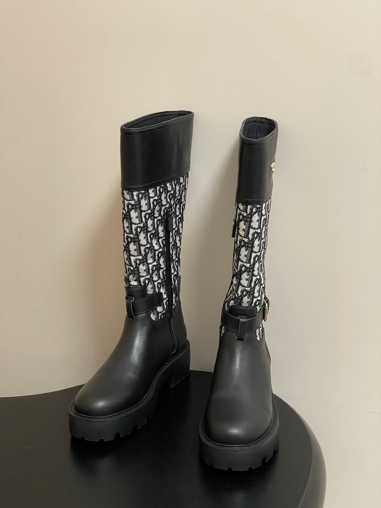 BLACK MID-CALF BOOTS WITH MONOGRAM FABRIC PANEL AND BUCKLE DETAIL