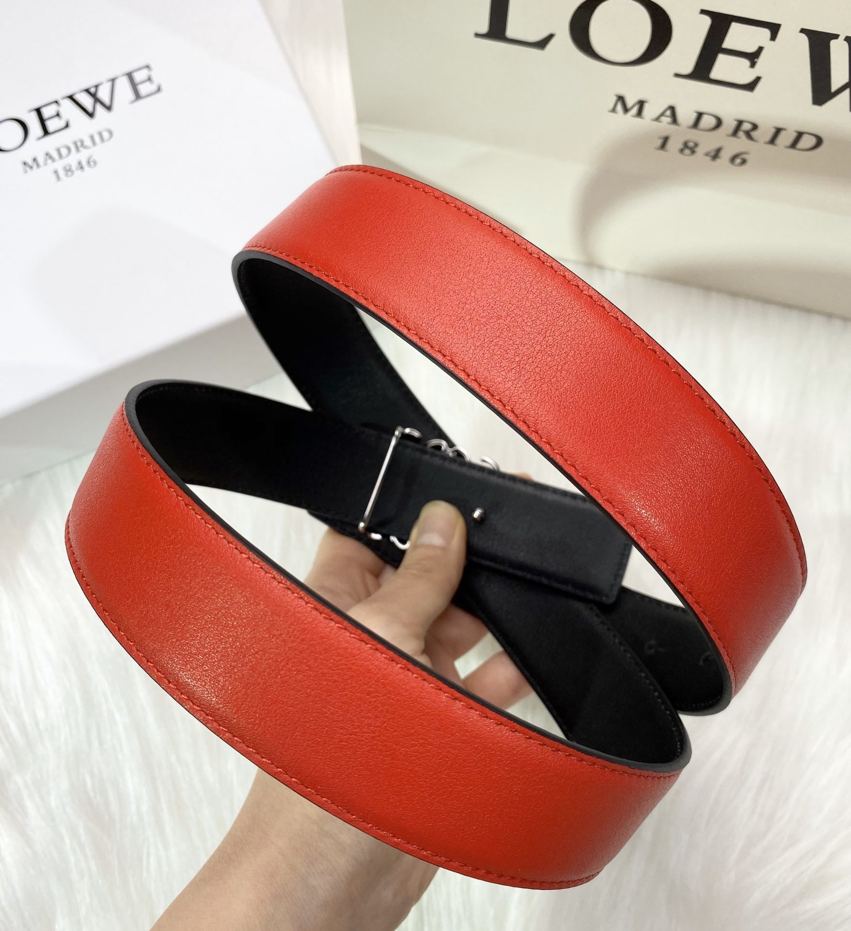 RED LEATHER BELT WITH SILVER ANAGRAM BUCKLE