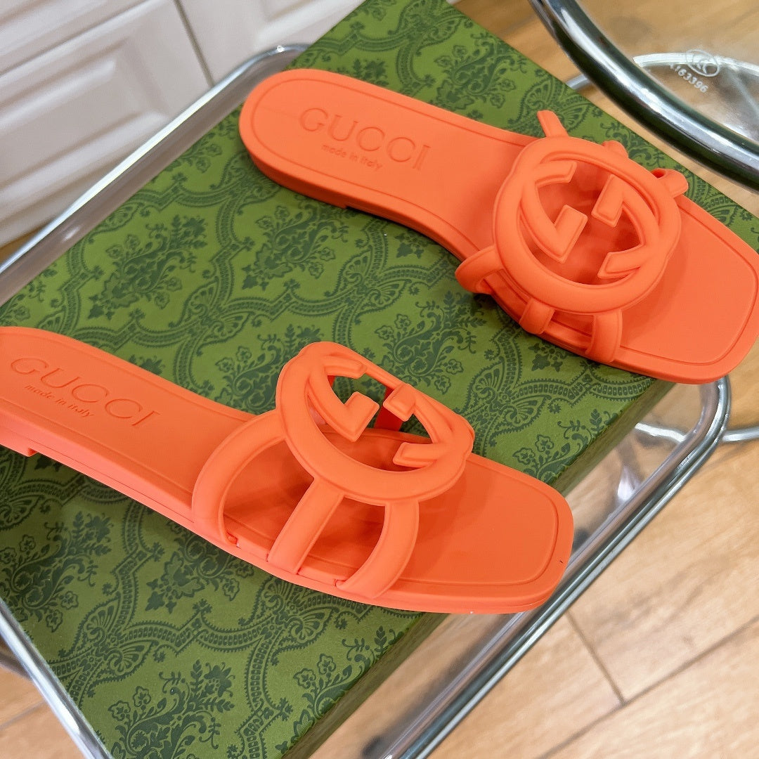 NEON ORANGE RUBBER SLIDE SANDALS WITH ROUND EMBLEM