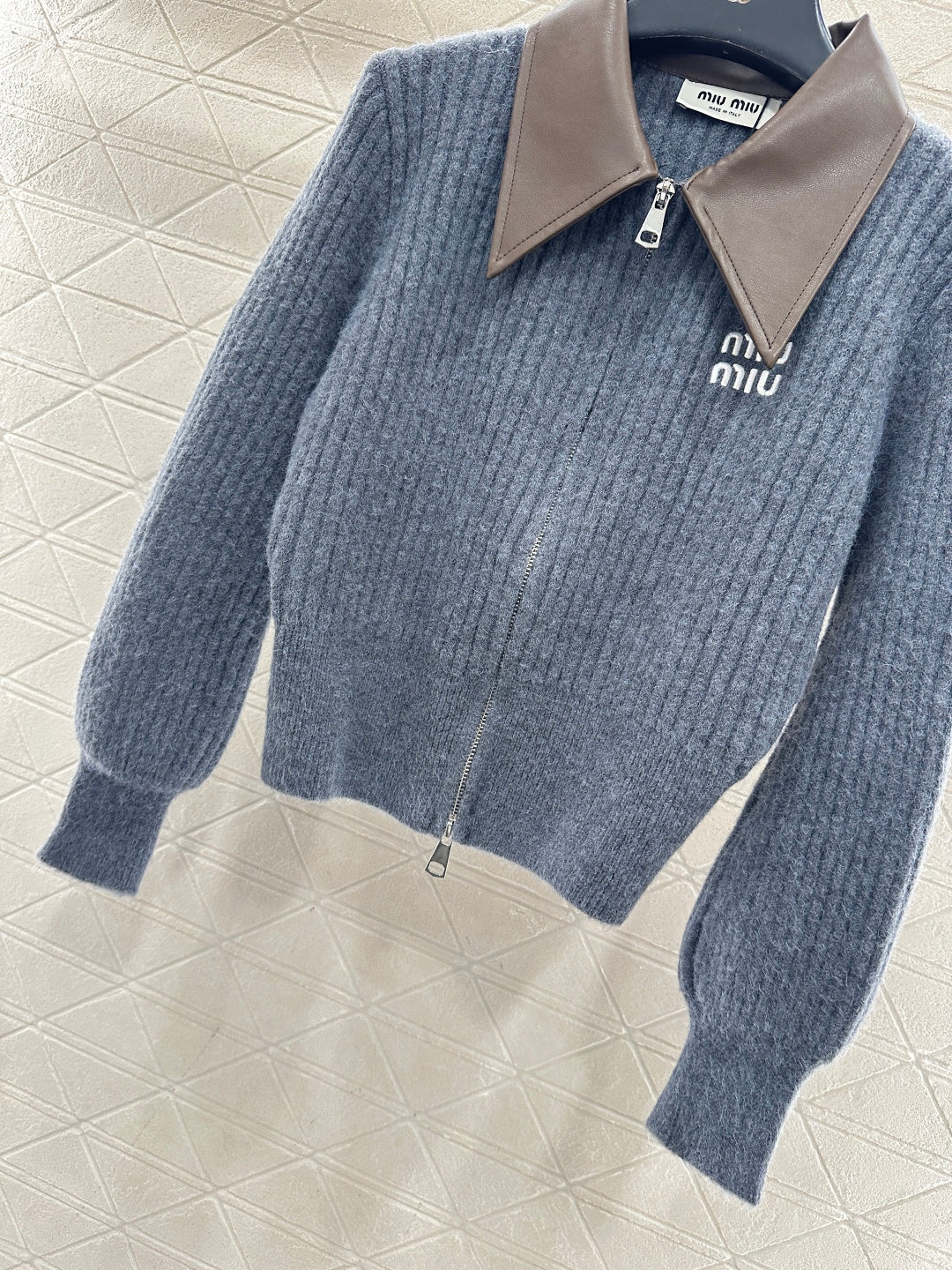 ZIP-UP RIBBED KNIT SWEATER
