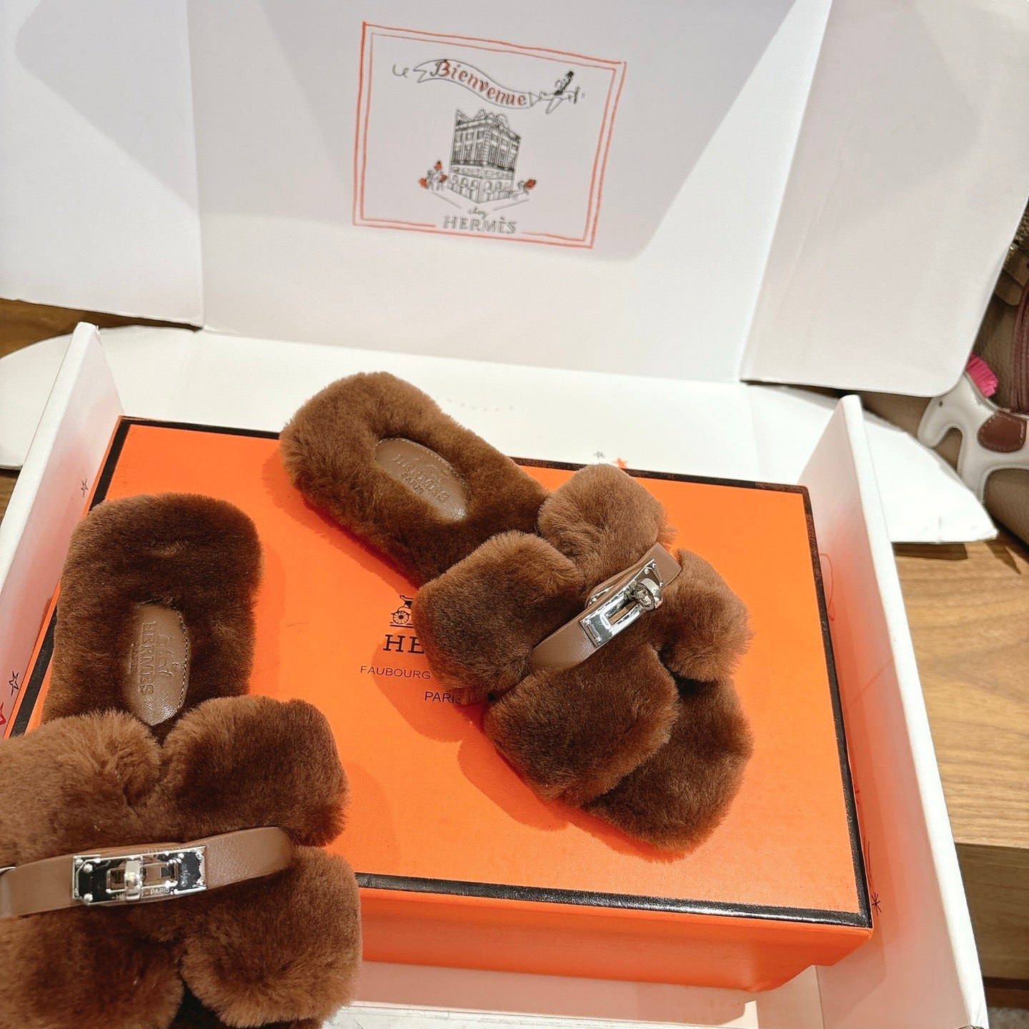 BROWN FAUX FUR MULE SLIPPERS WITH SILVER-TONE ACCENT