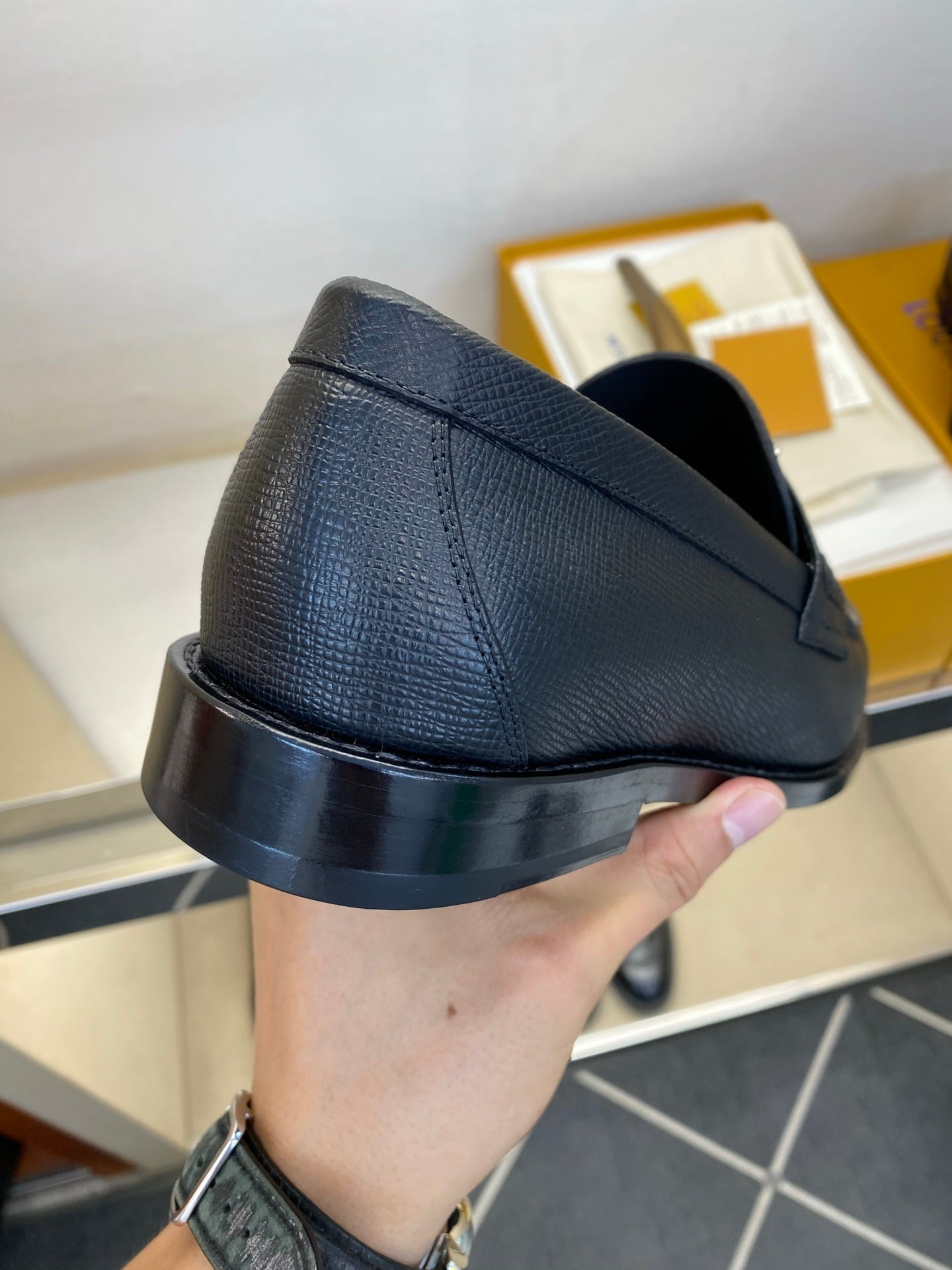 BLACK LEATHER SLIP-ON LOAFERS WITH METAL DETAIL