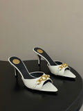 WHITE POINTED TOE MULE HEELS WITH GOLD DETAIL