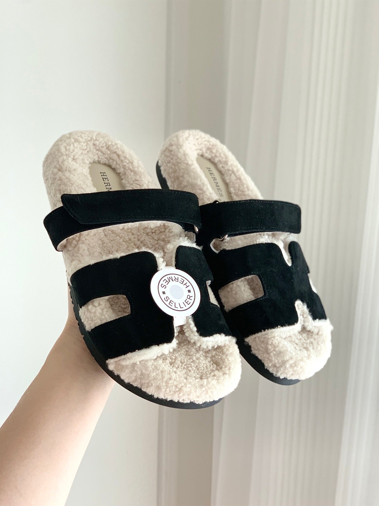 SHEARLING SLIDE SANDALS WITH BLACK STRAPS