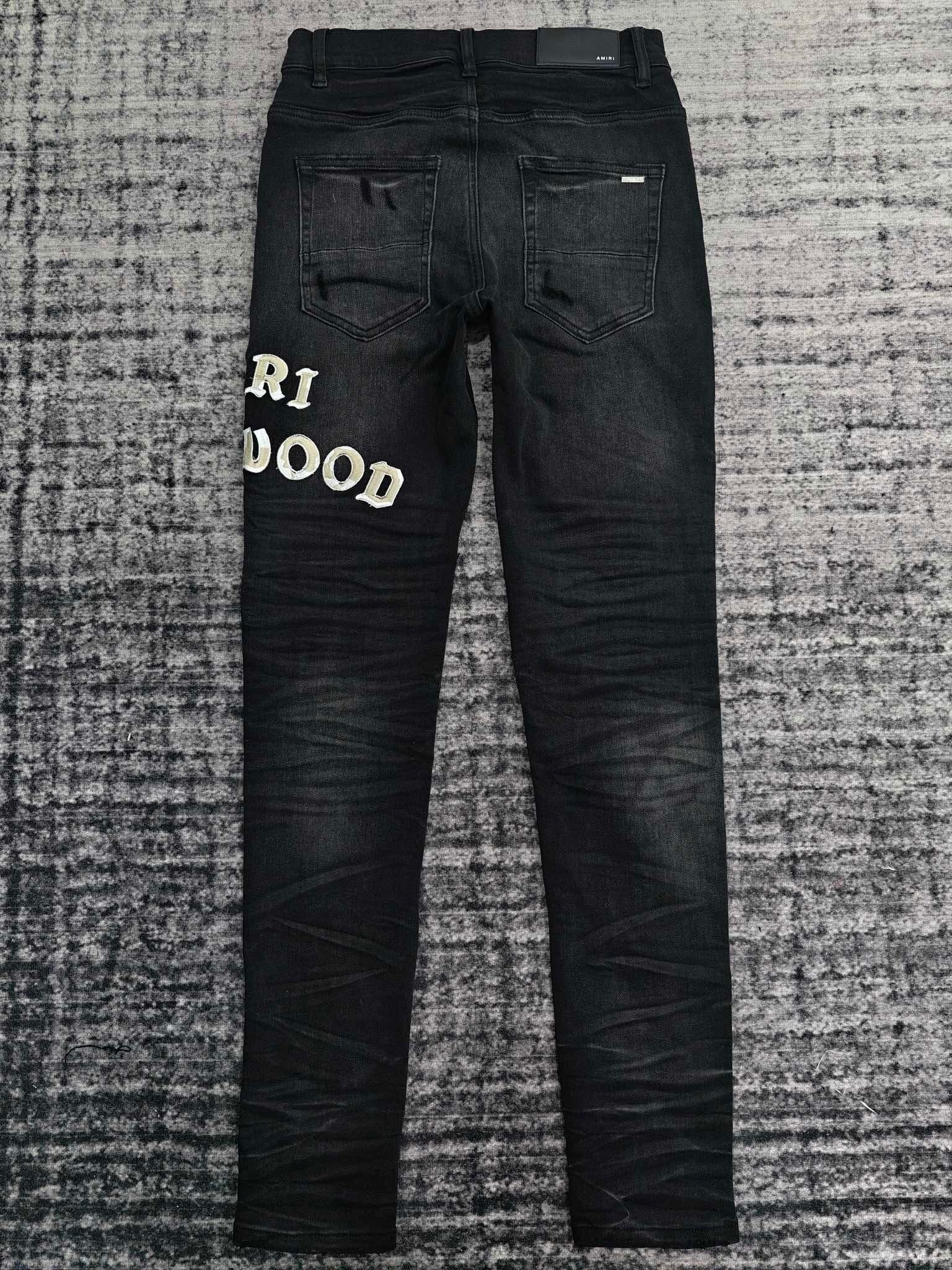 DISTRESSED LOGO APPLIQUÉ SKINNY JEANS