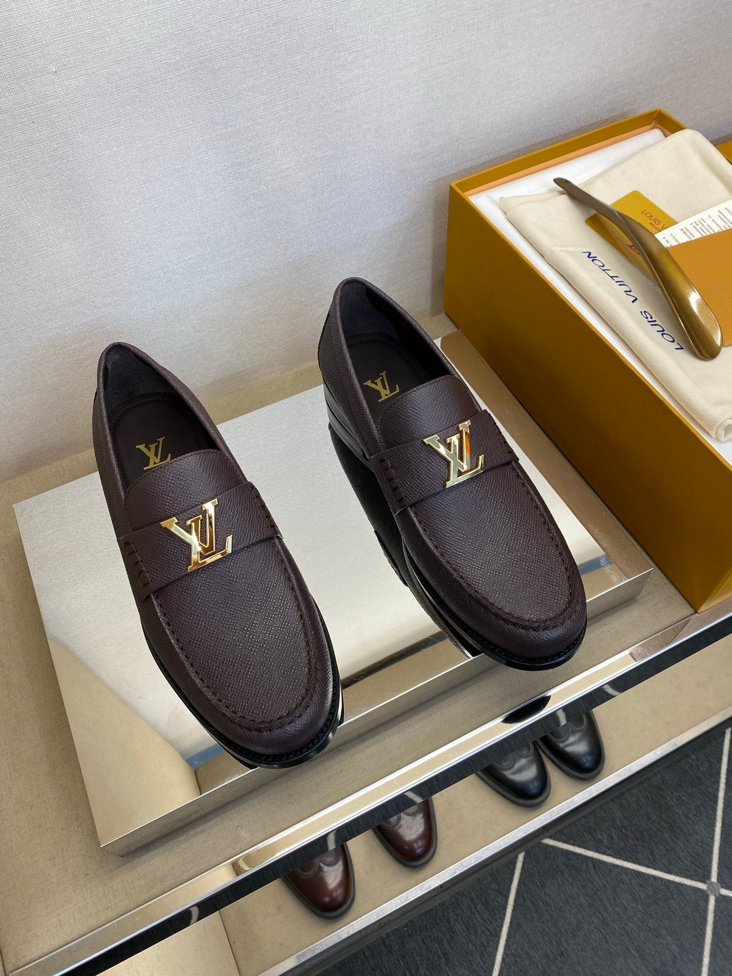 BROWN LEATHER SLIP-ON LOAFERS WITH GOLD-TONE ACCENT