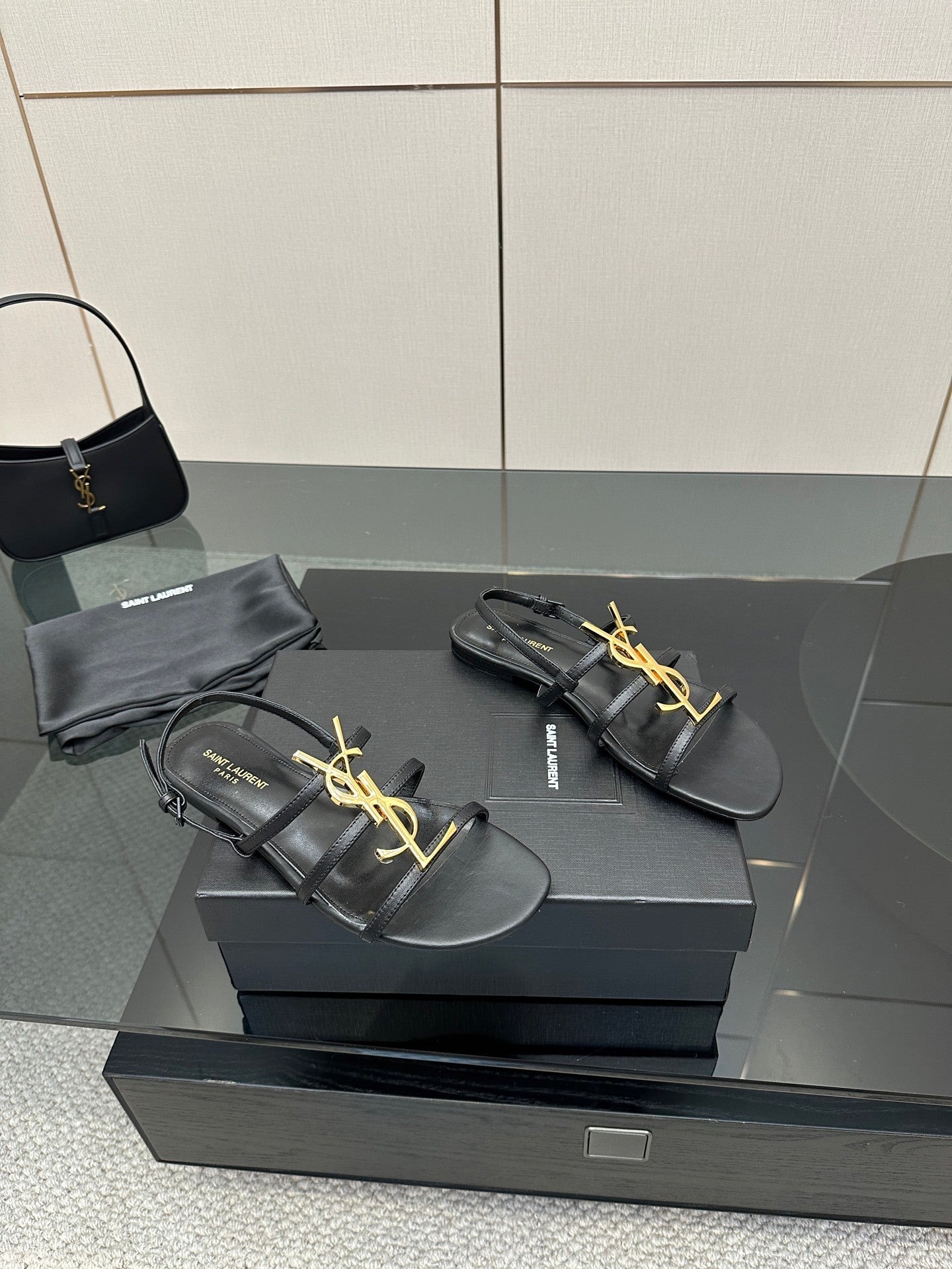 BLACK STRAPPY FLAT SANDALS WITH GOLD LOGO DETAIL
