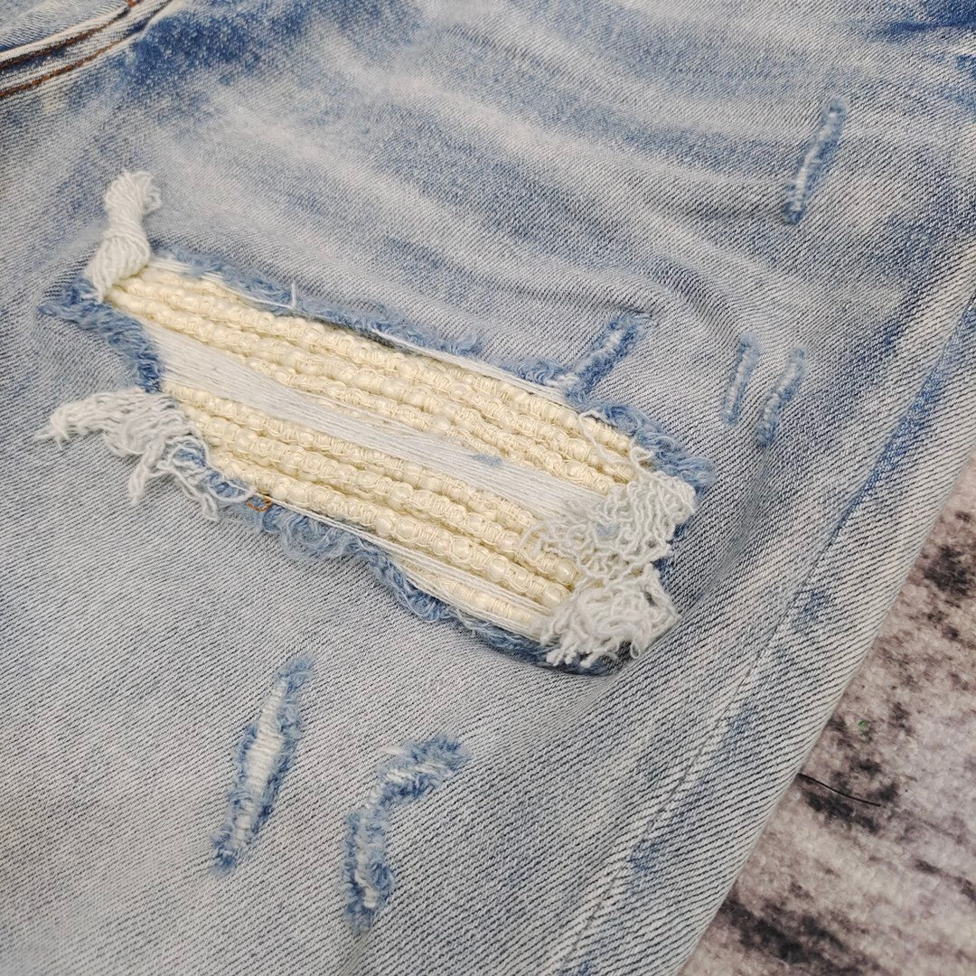 DISTRESSED LOGO PATCH SKINNY JEANS