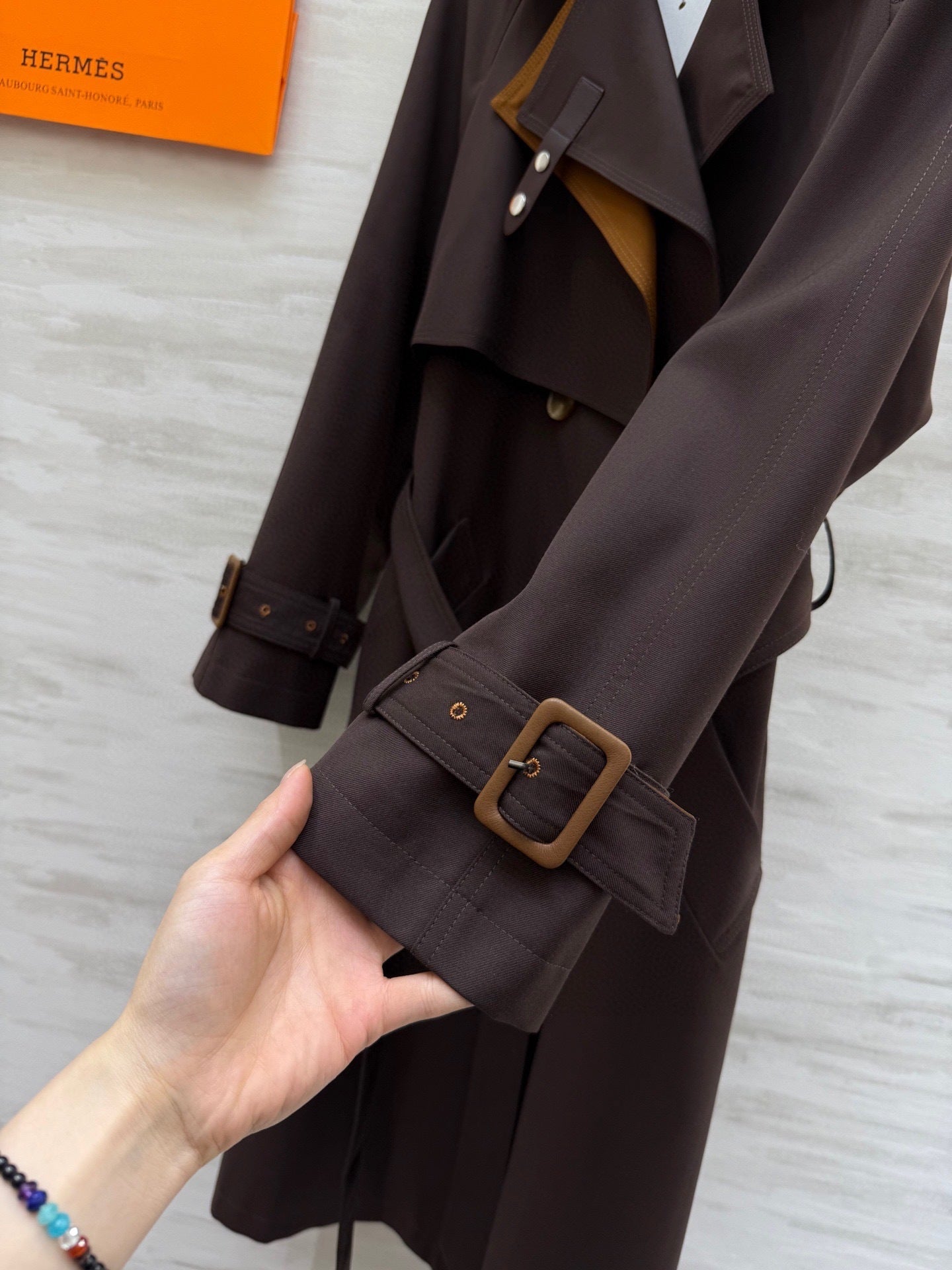 BELTED LONG TRENCH COAT WITH ASYMMETRIC FRONT DETAIL