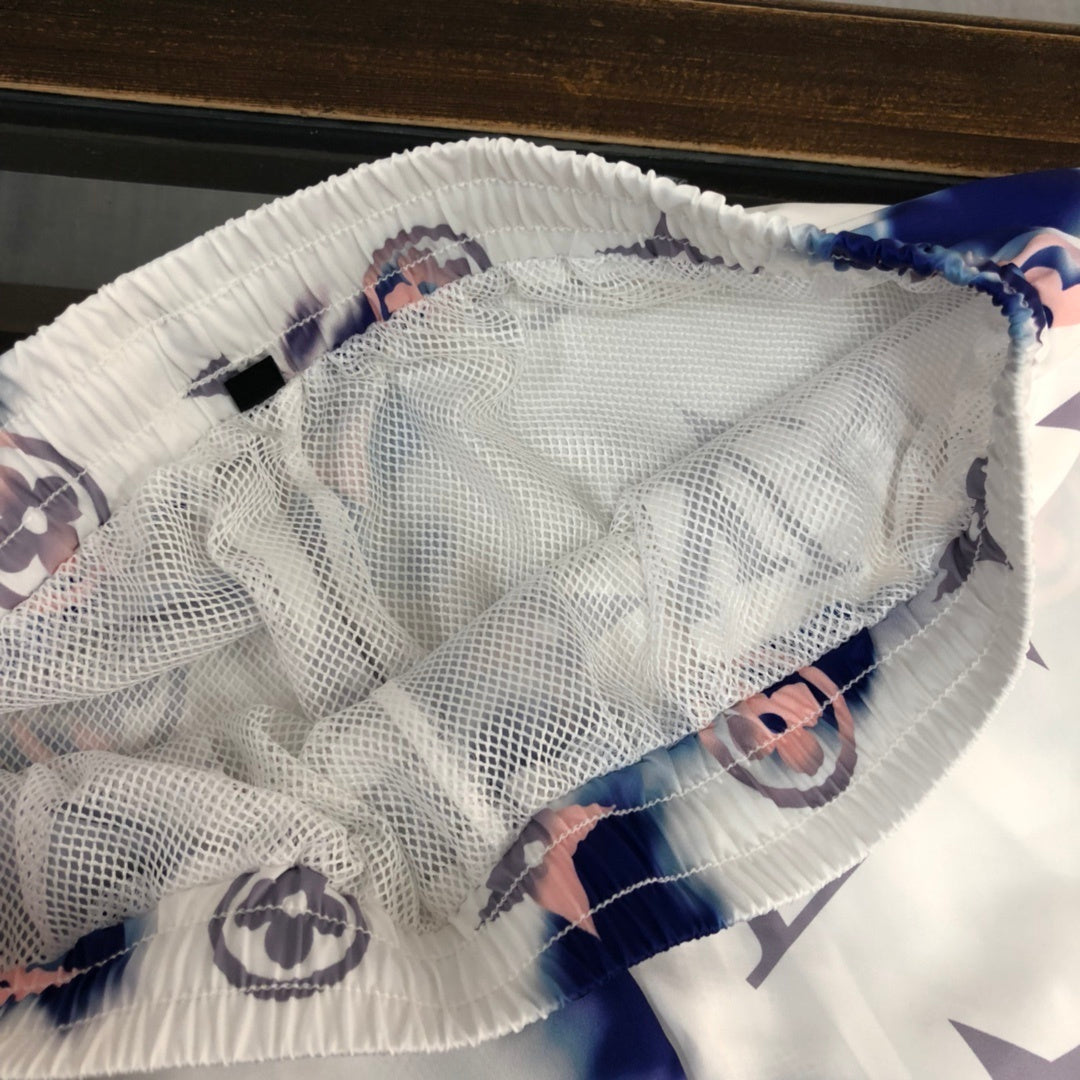 WHITE TIE-DYE PRINT SWIM SHORTS