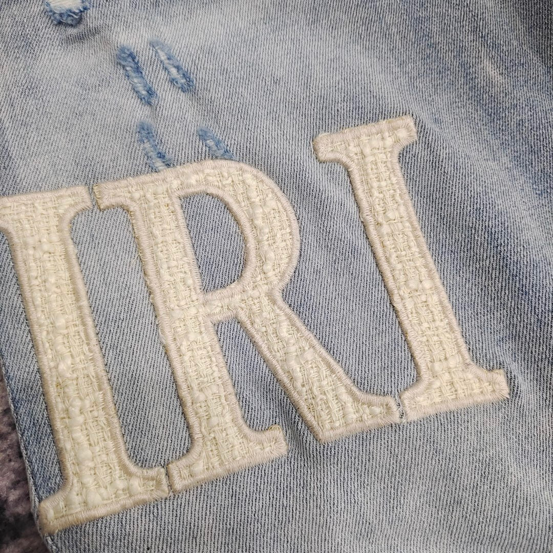 DISTRESSED LOGO PATCH SKINNY JEANS