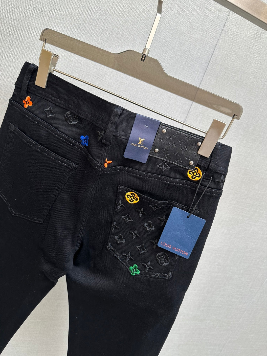 BLACK DENIM JEANS WITH EMBROIDERED DETAILING