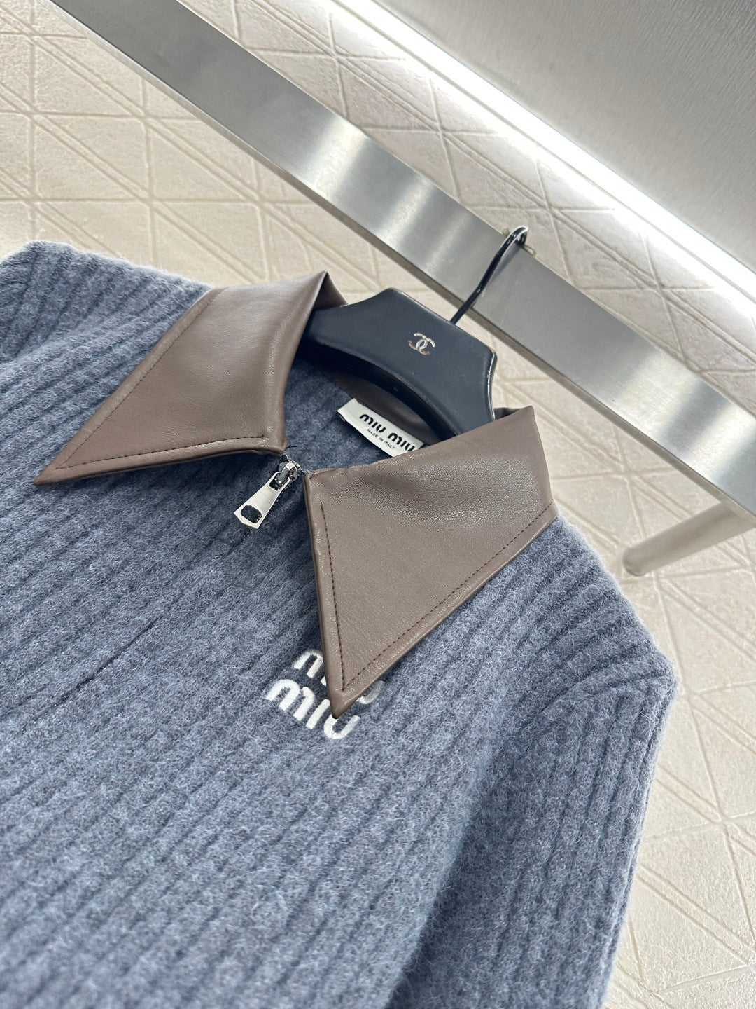 ZIP-UP RIBBED KNIT SWEATER
