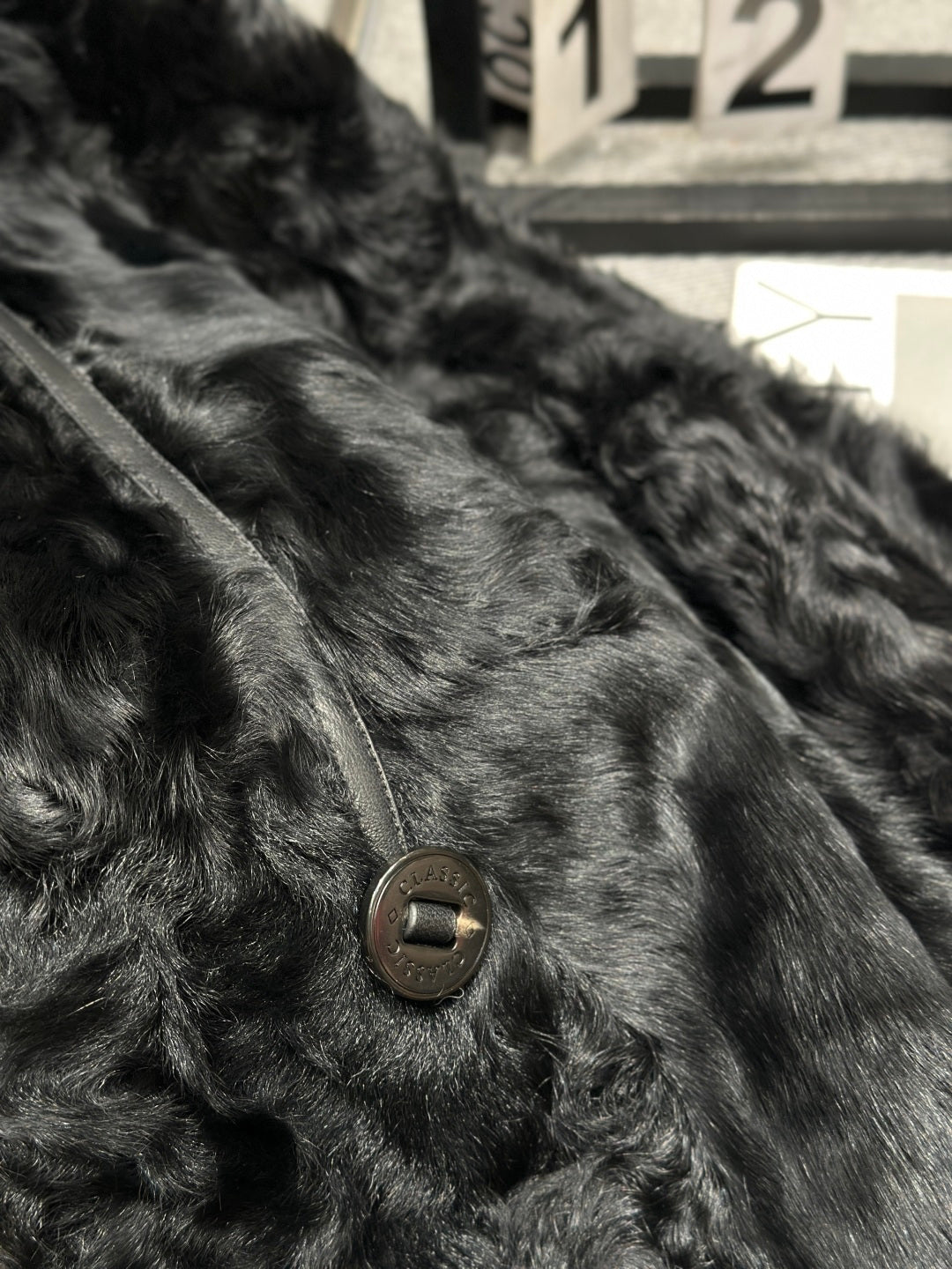 LUXURY BLACK TEXTURED FUR COAT WITH LEATHER BELT DETAIL