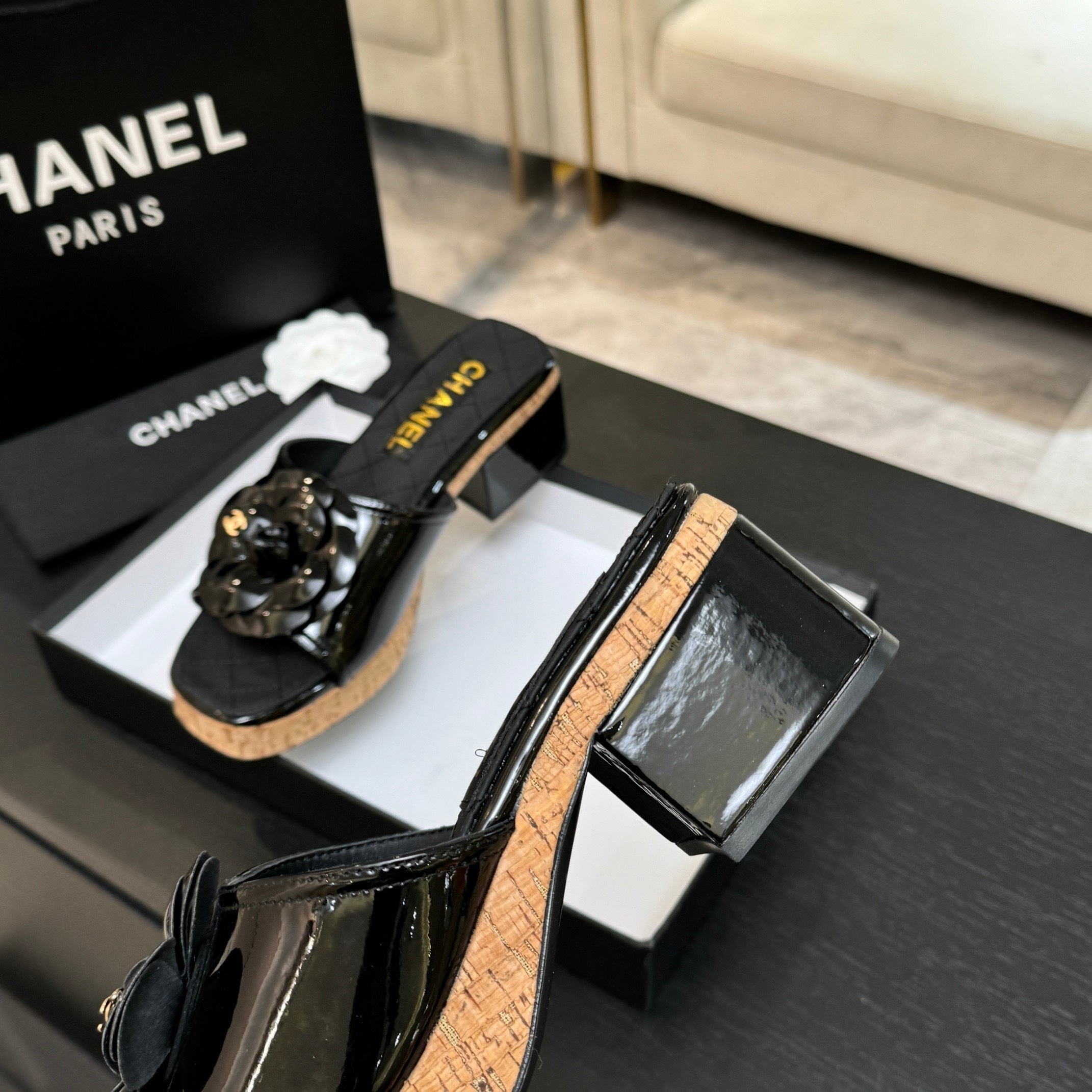 BLACK QUILTED PLATFORM SLIDE SANDALS WITH FLORAL DETAIL