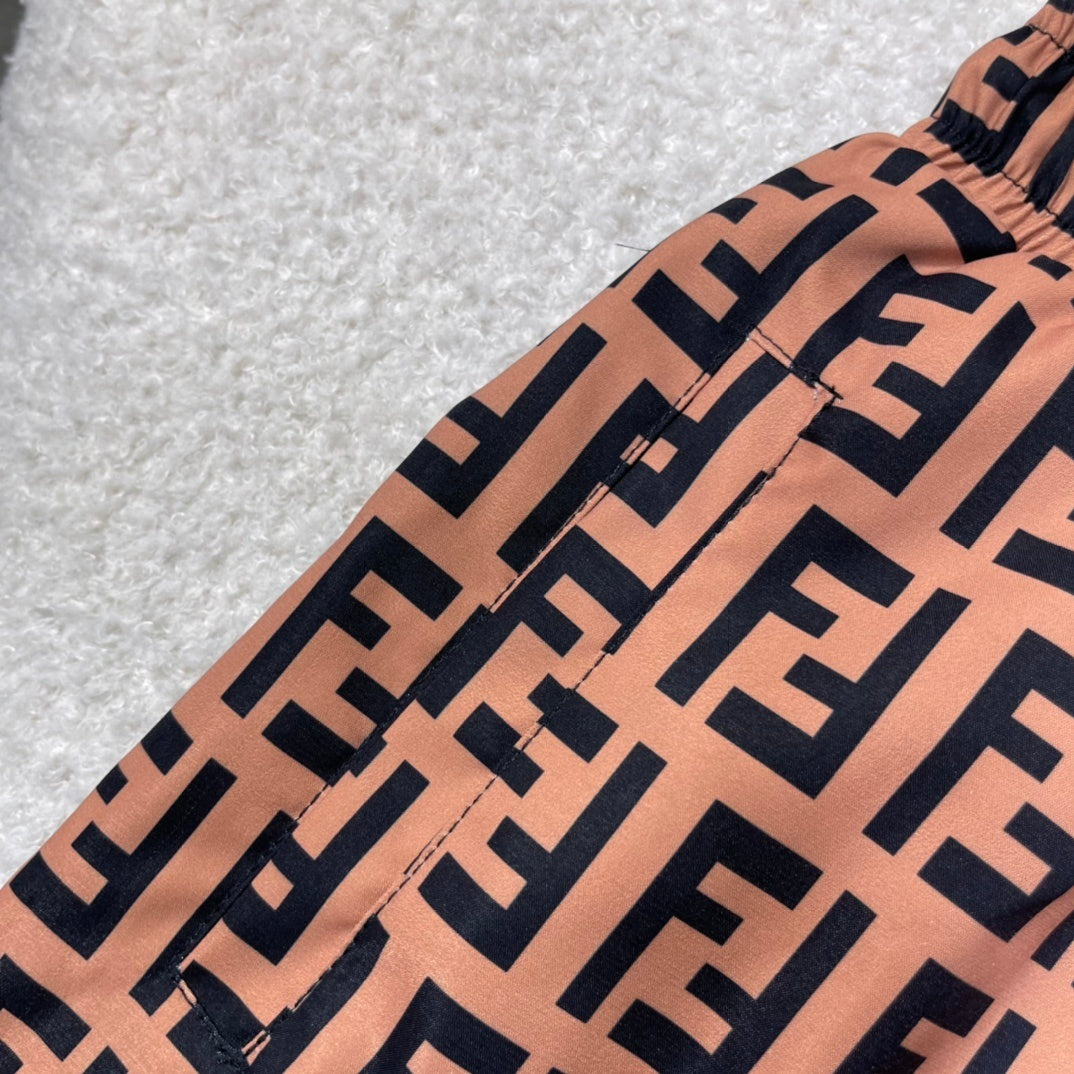 MONOGRAM SWIM SHORTS – BROWN