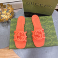 NEON ORANGE RUBBER SLIDE SANDALS WITH ROUND EMBLEM