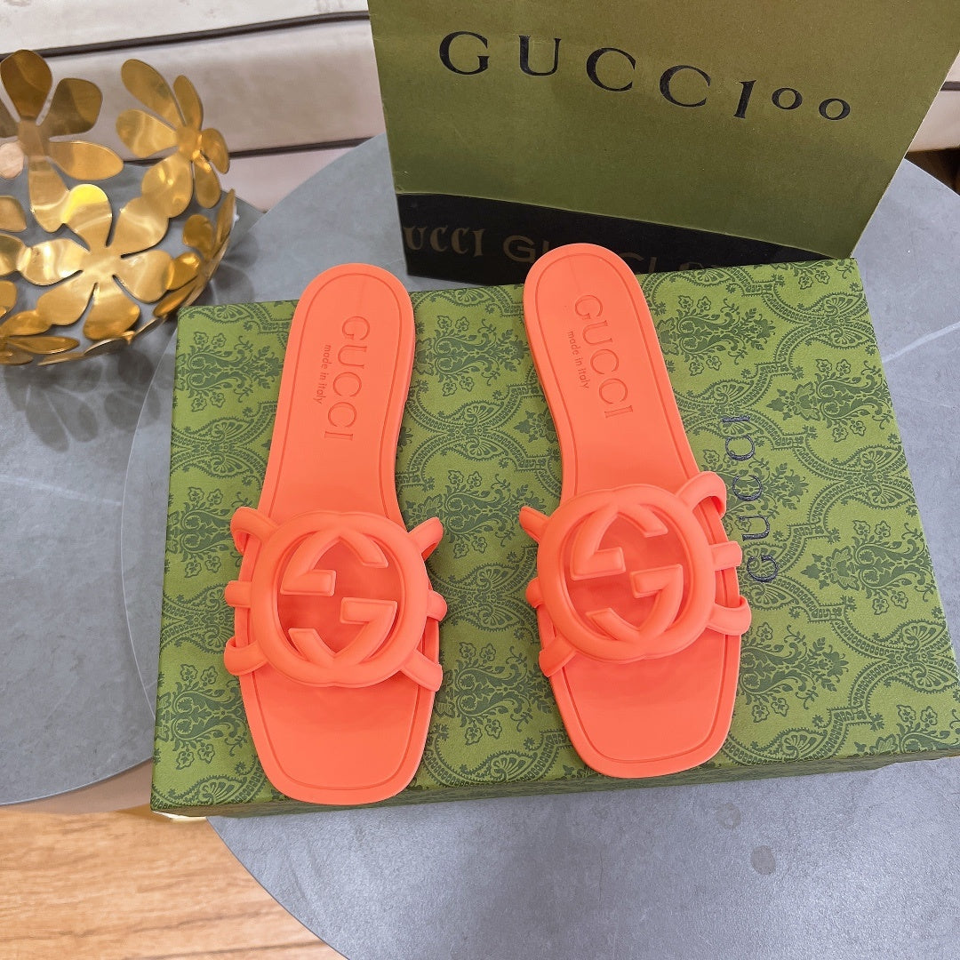 NEON ORANGE RUBBER SLIDE SANDALS WITH ROUND EMBLEM