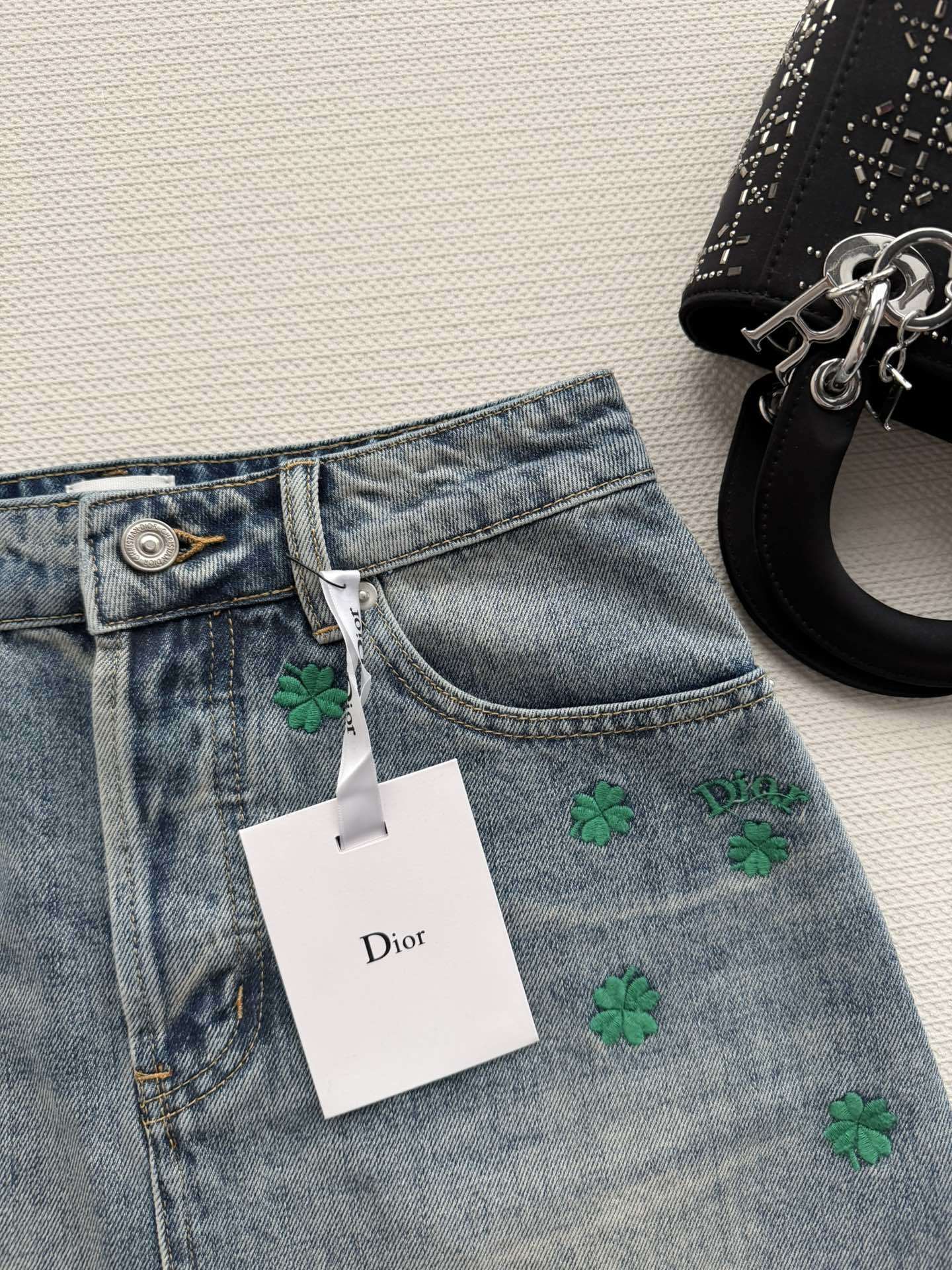 BLUE DENIM MINI SKIRT WITH FLORAL EMBROIDERY