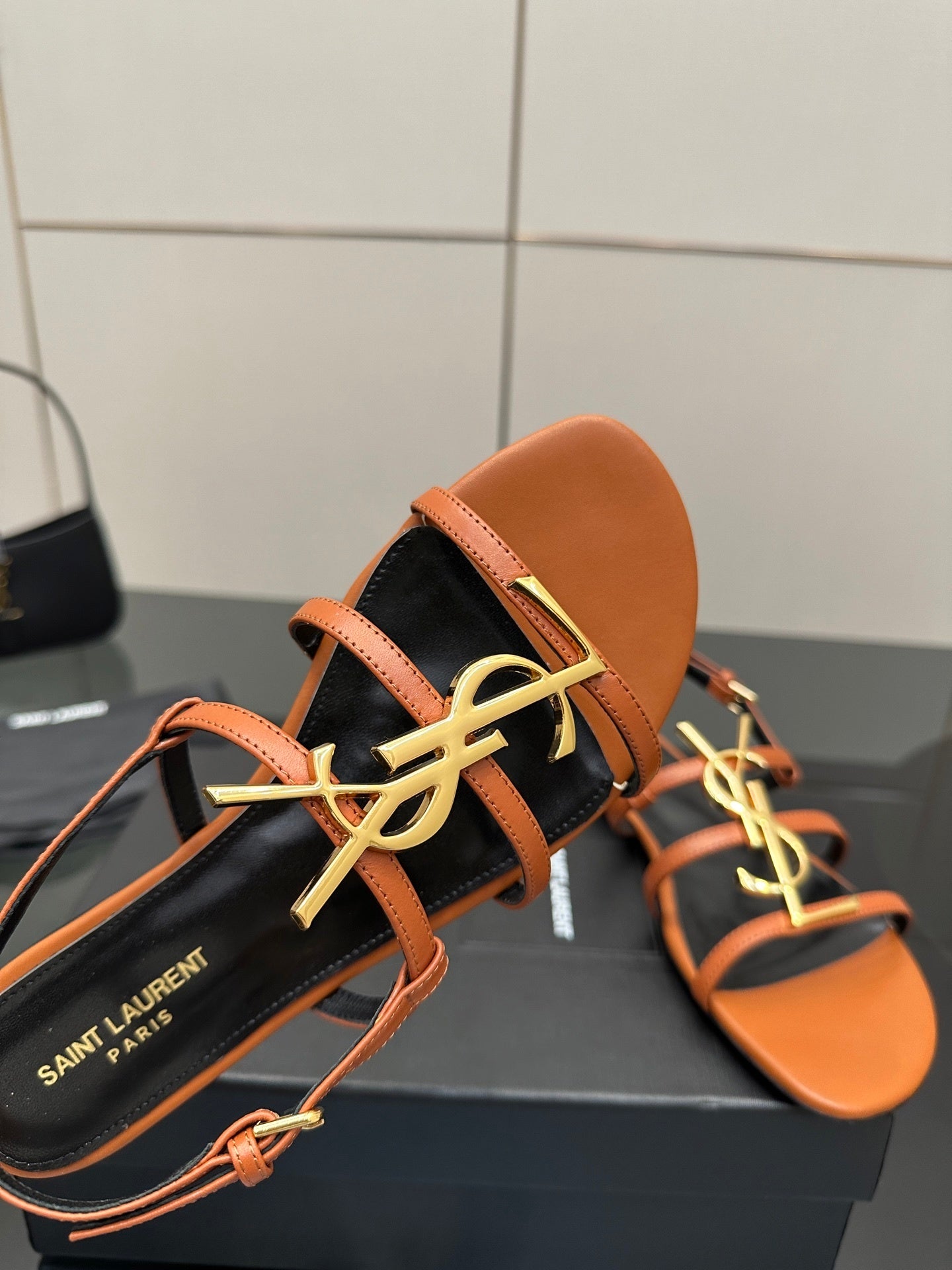 TAN STRAPPY FLAT SANDALS WITH GOLD LOGO DETAIL