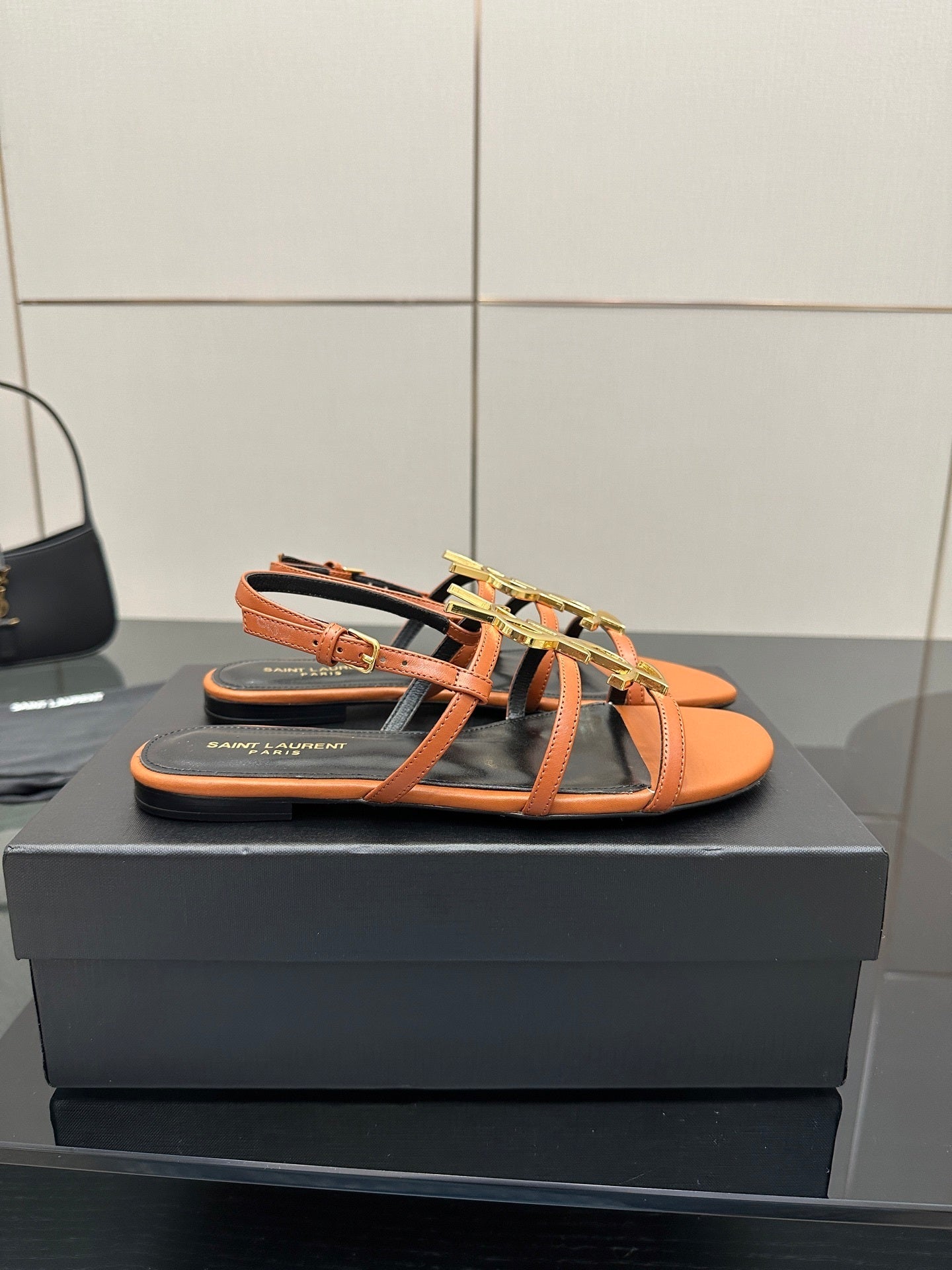TAN STRAPPY FLAT SANDALS WITH GOLD LOGO DETAIL